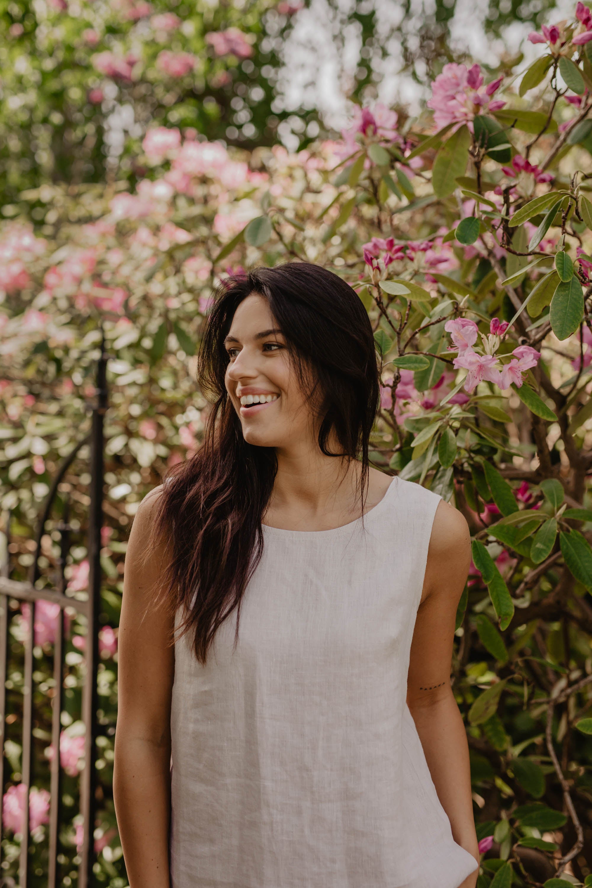 Close Up Of Woman Wearing A White Linen Top