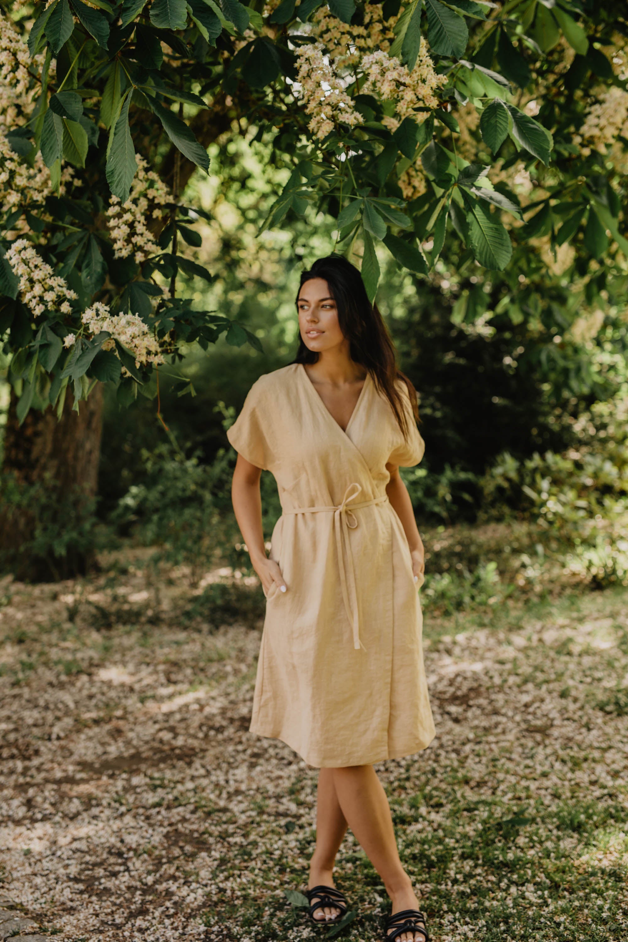 Woman In Nature Wearing A Yellow Linen Dress