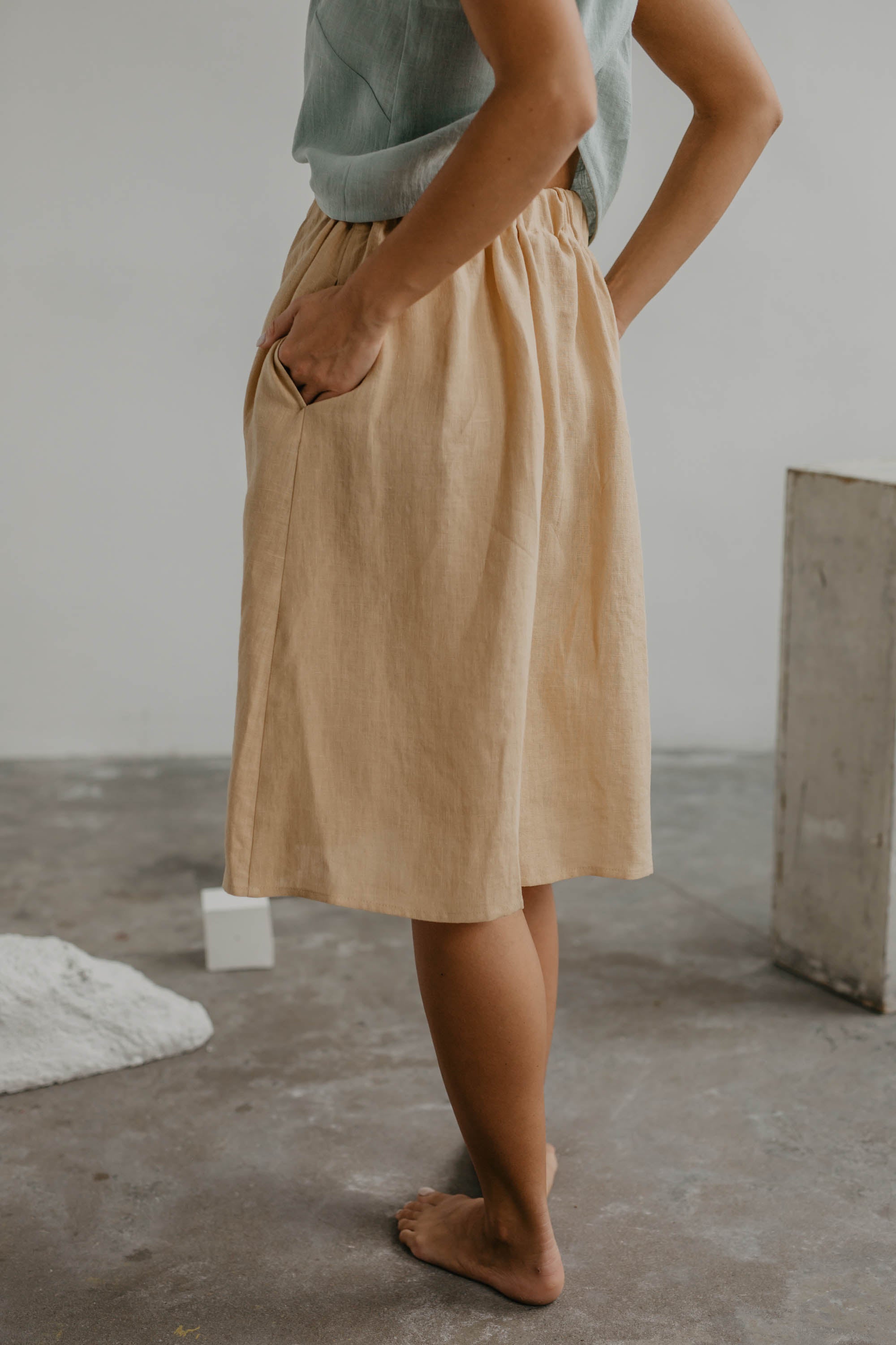 Side View Of Woman Wearing A Mustard Button Skirt By AmourLinen