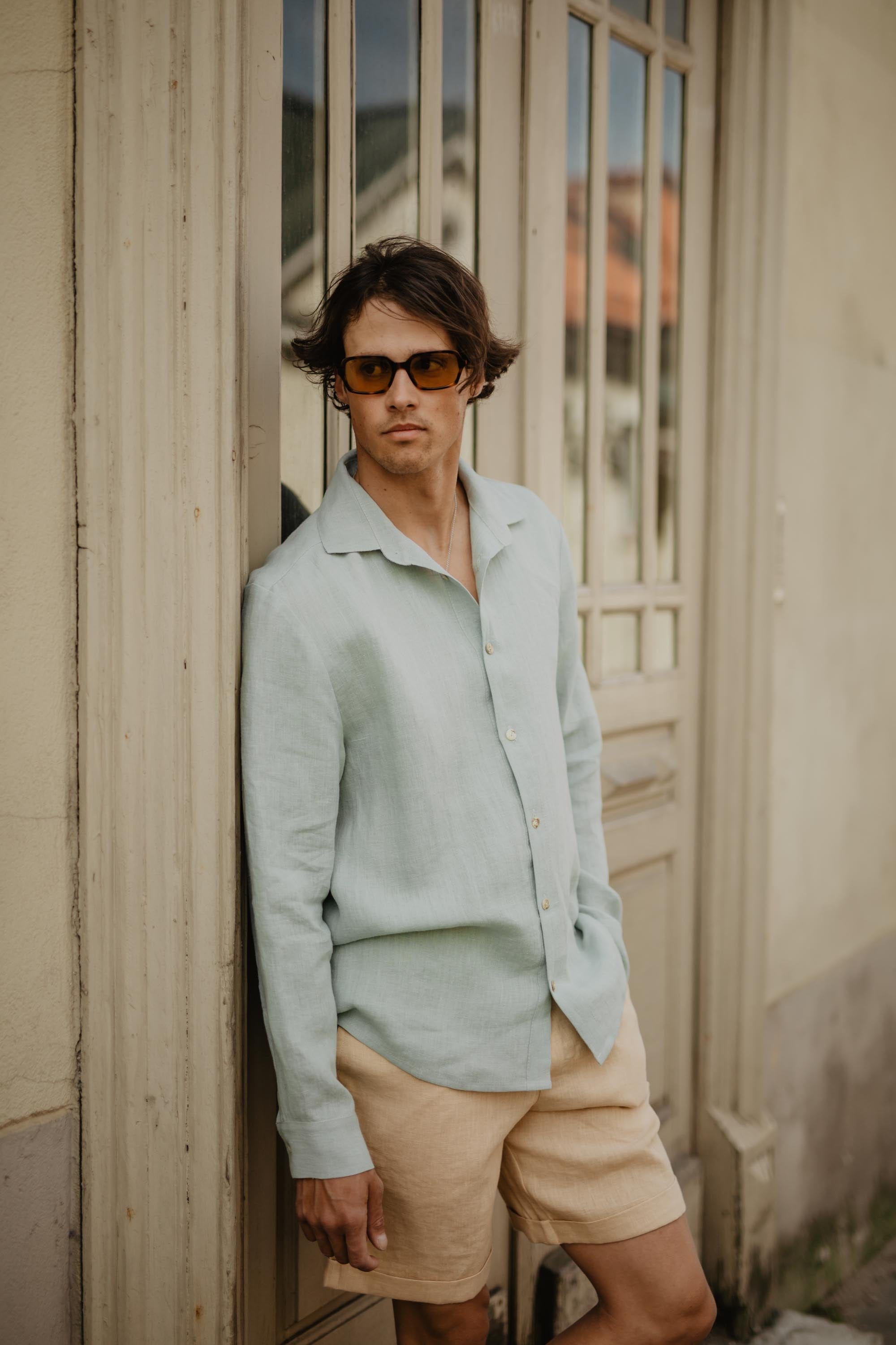 Man Wearing Sage Green Classic Shirt Leaning On Door