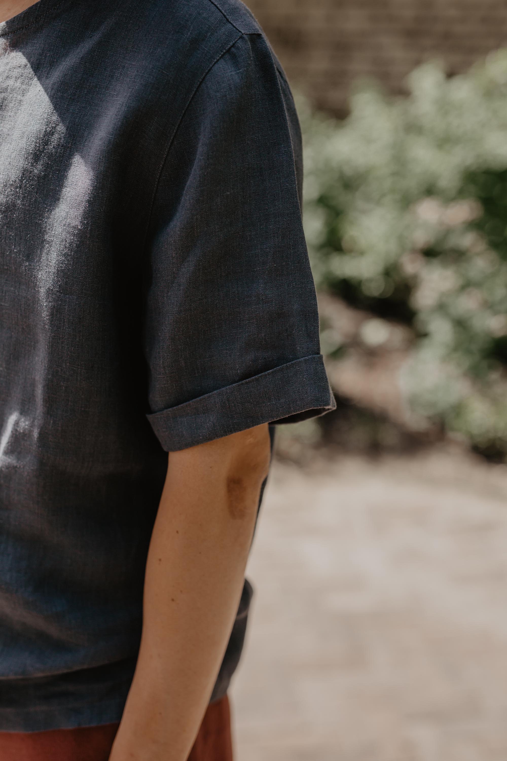 Close Up Of Mens Oversized Black Linen T-shirt Sleeve