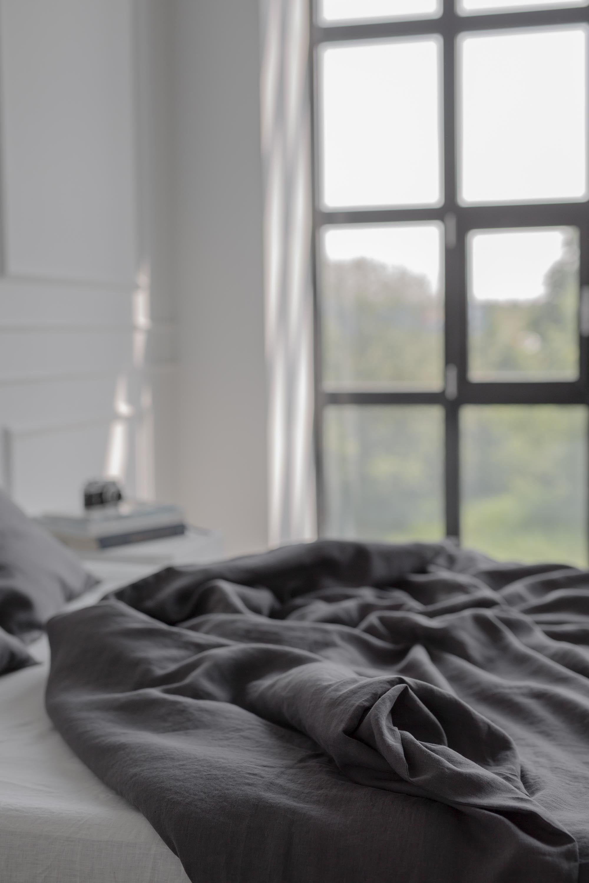 Close Up Of Bed With Charcoal Linen Bedding Set