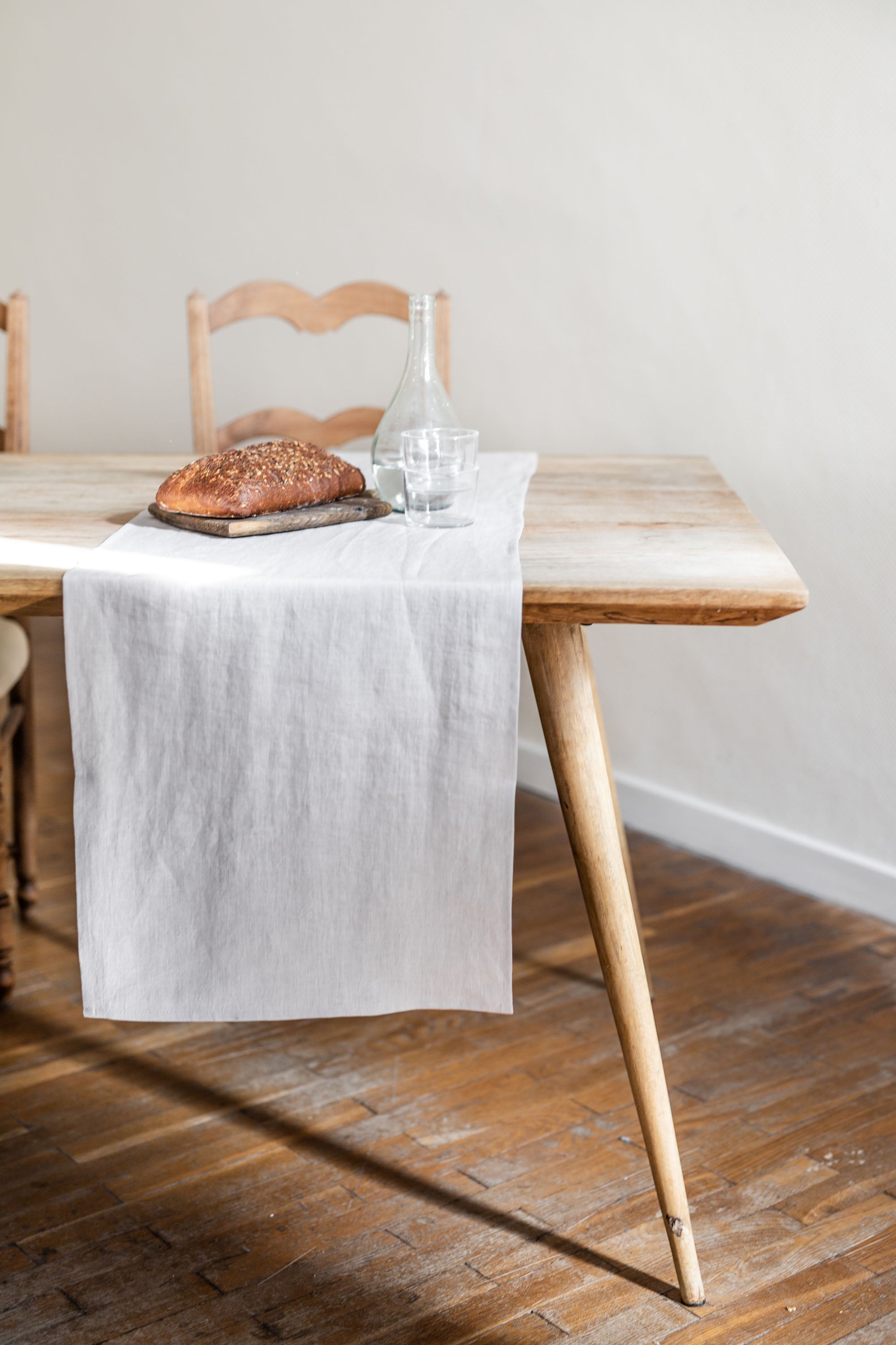 Side View Of  Dinner Table With Cream Linen Table Runner By AmourlInen