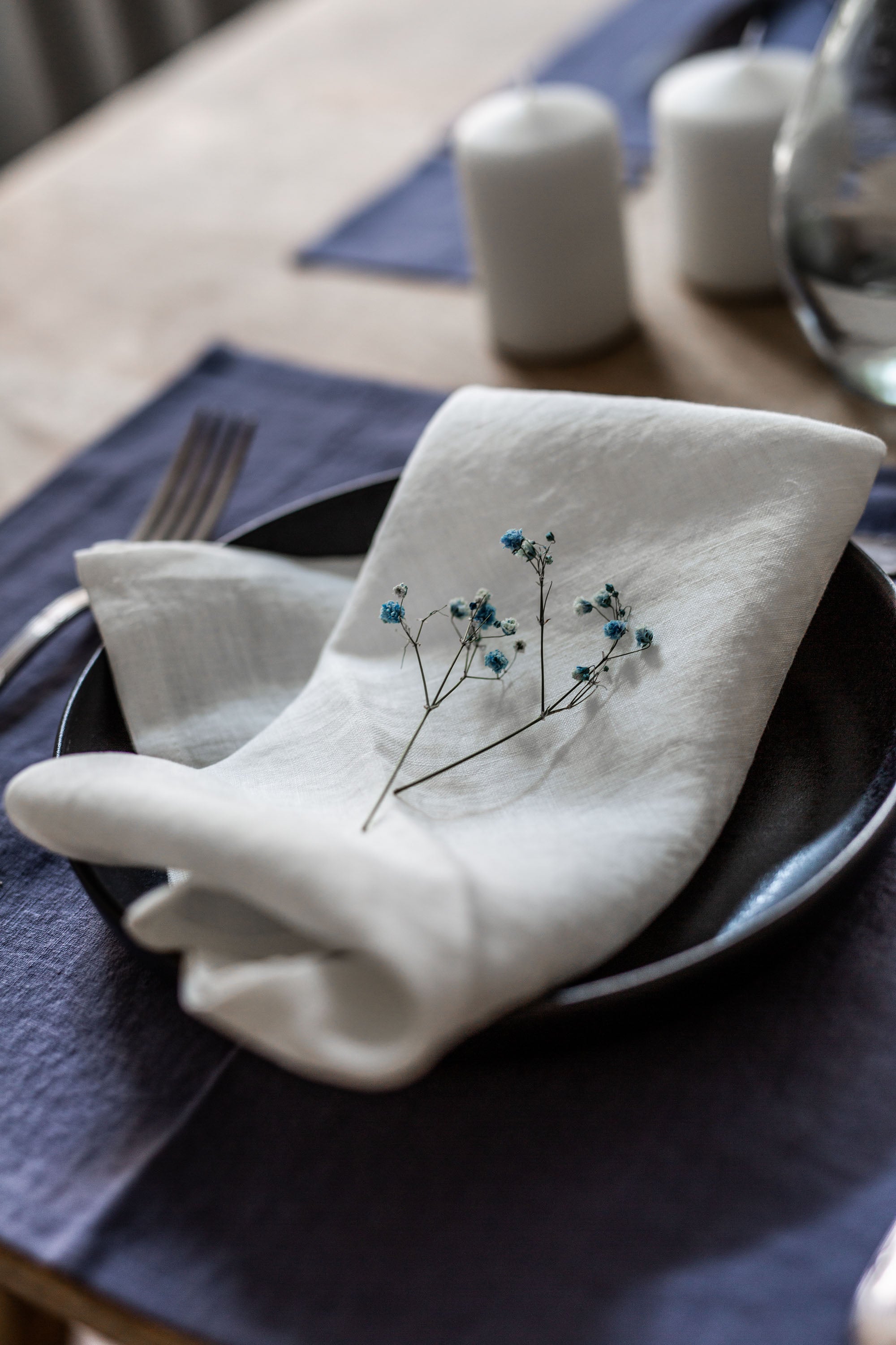 Set Dinner Table With A Focus on White Linen Napkins By AmourlInen