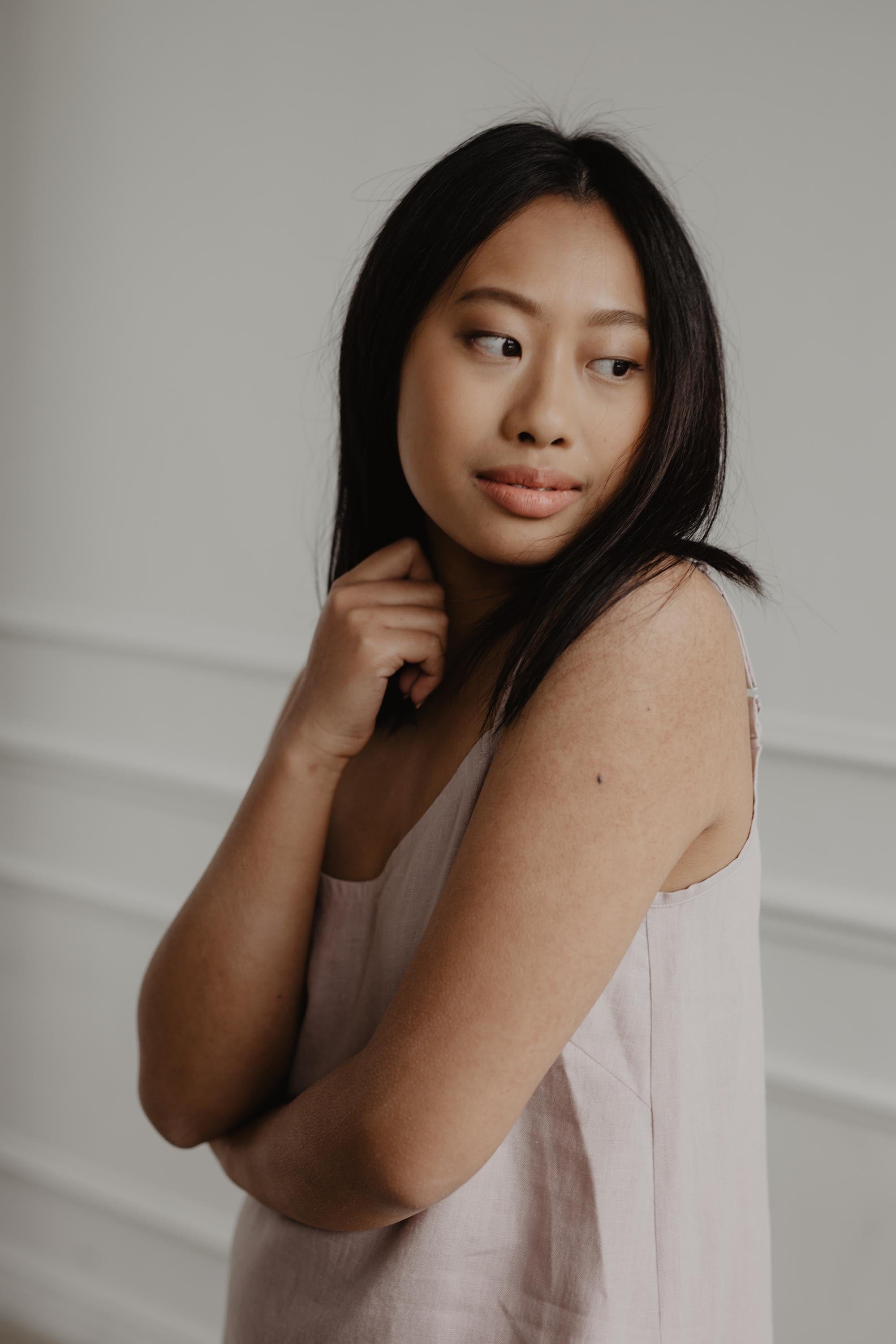 Close Up Of Woman Wearing A White Linen Night Gown By AmourLinen