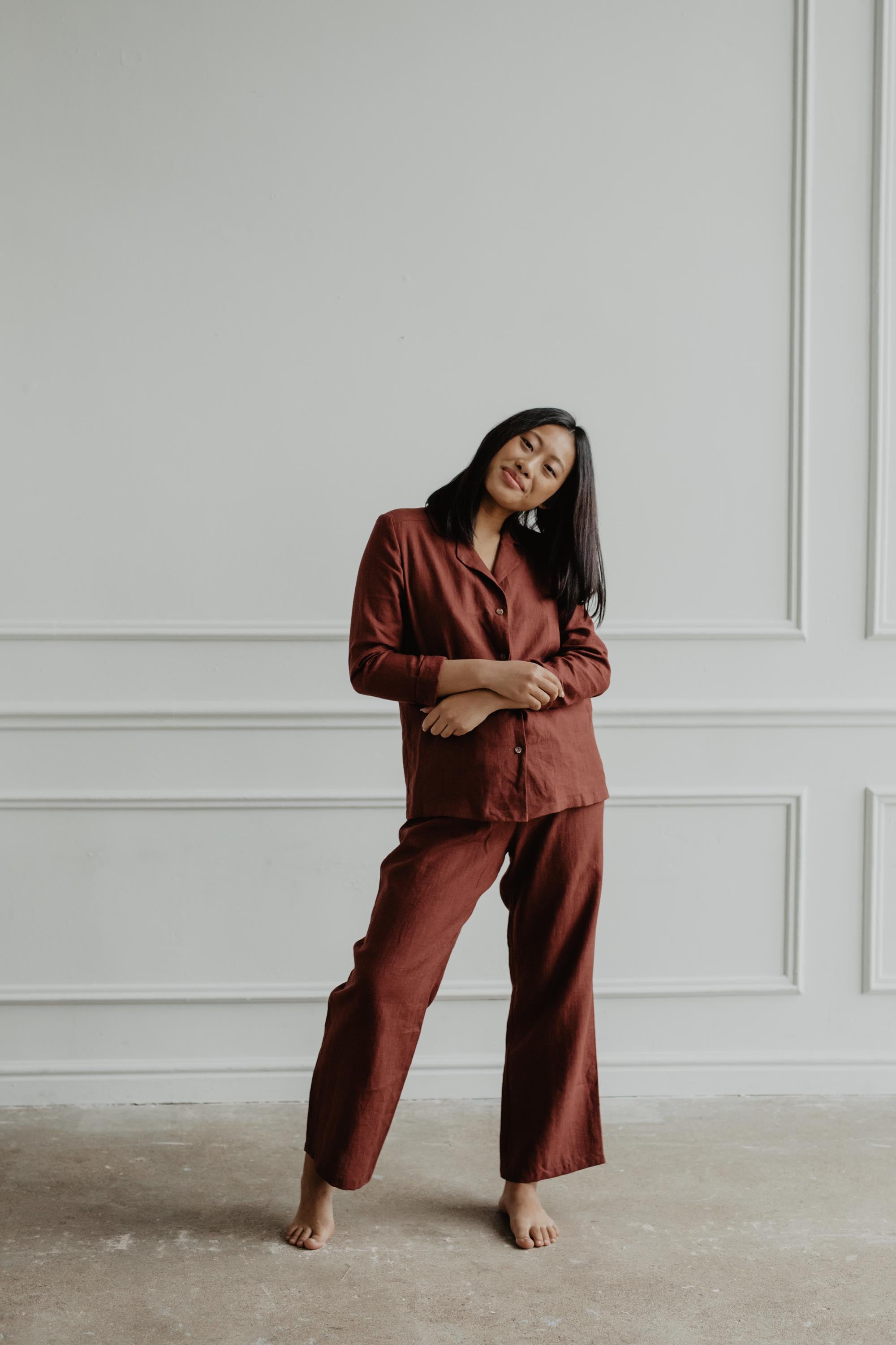 Woman Wearing A Terracotta Long Sleeve Linen Pajama Set By AmourLinen