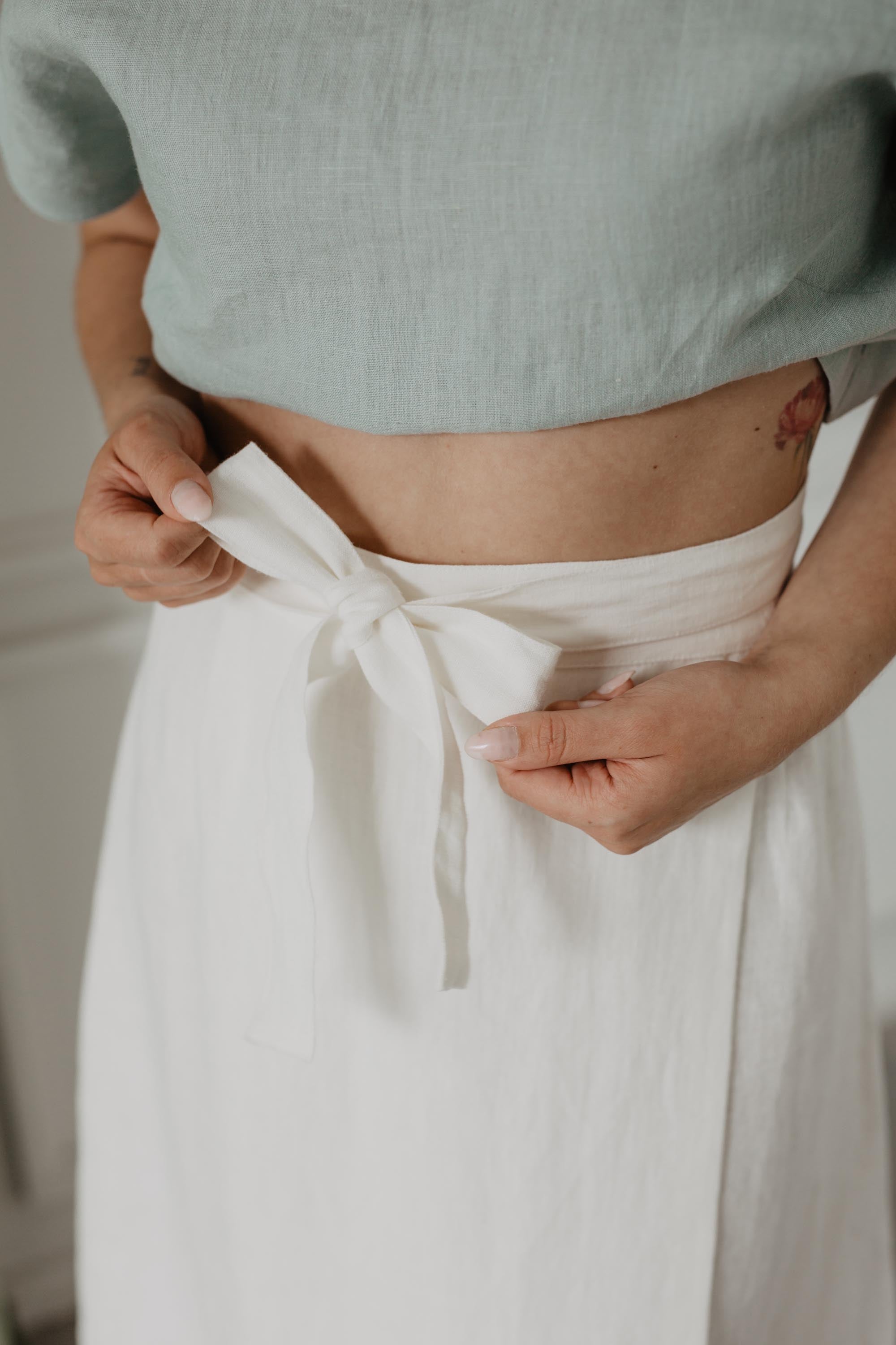 Close Up Of White Linen Wrap Skirt Ribbon