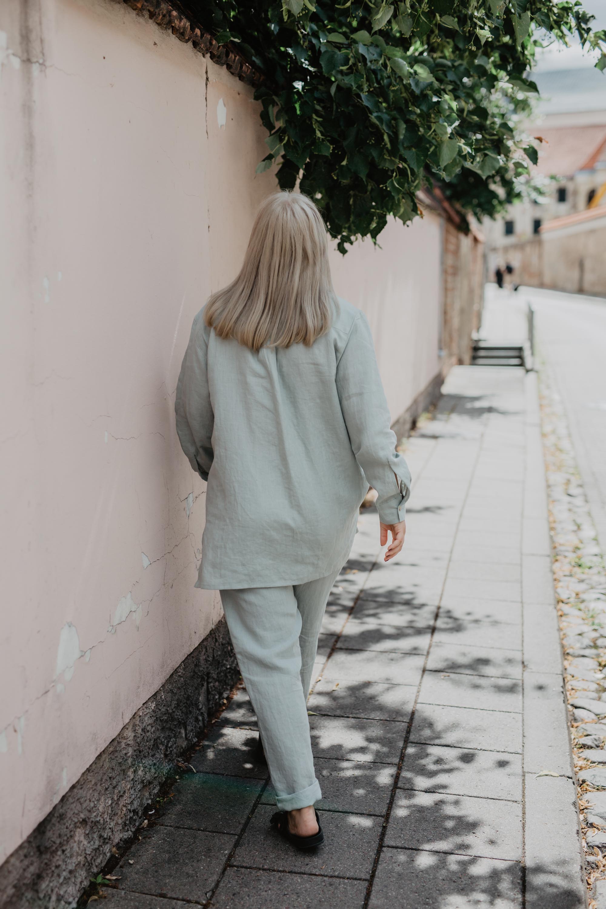 Woman Walking Away Wearing Sage Green Linen Suit Set By AmourLInen
