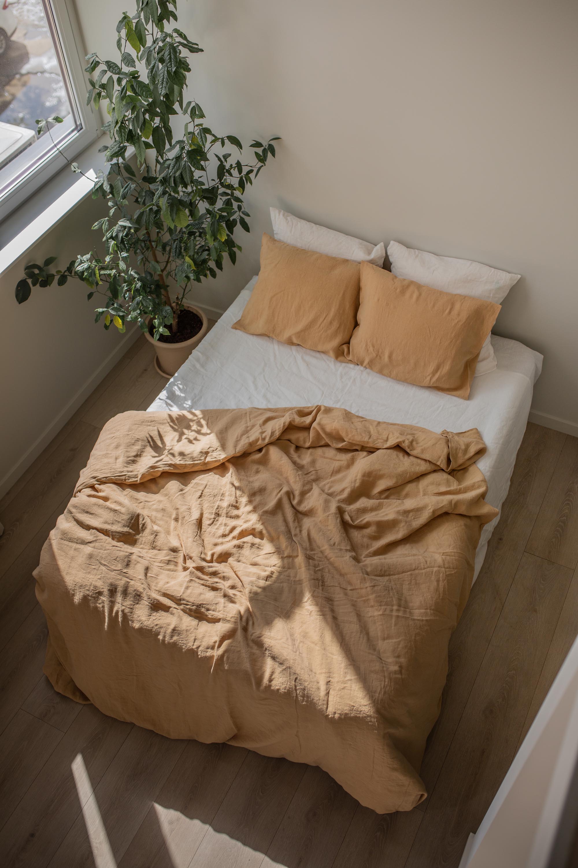 Top View of Bed With A Linen Duvet Cover In Mustard By AmourlInen
