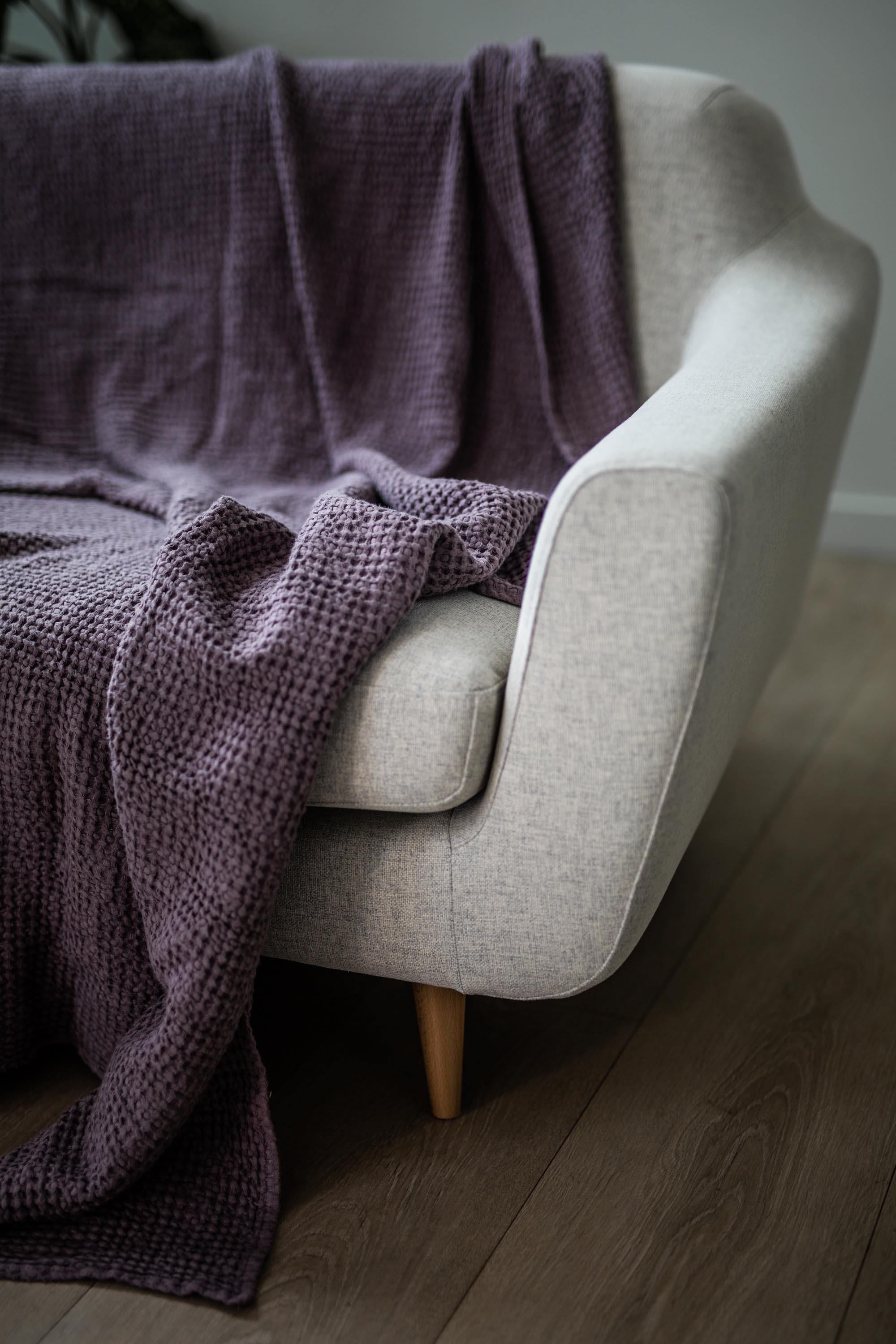 Close Up of Sofa With Linen Waffle Bed Throw in Dusty Lavender On Top