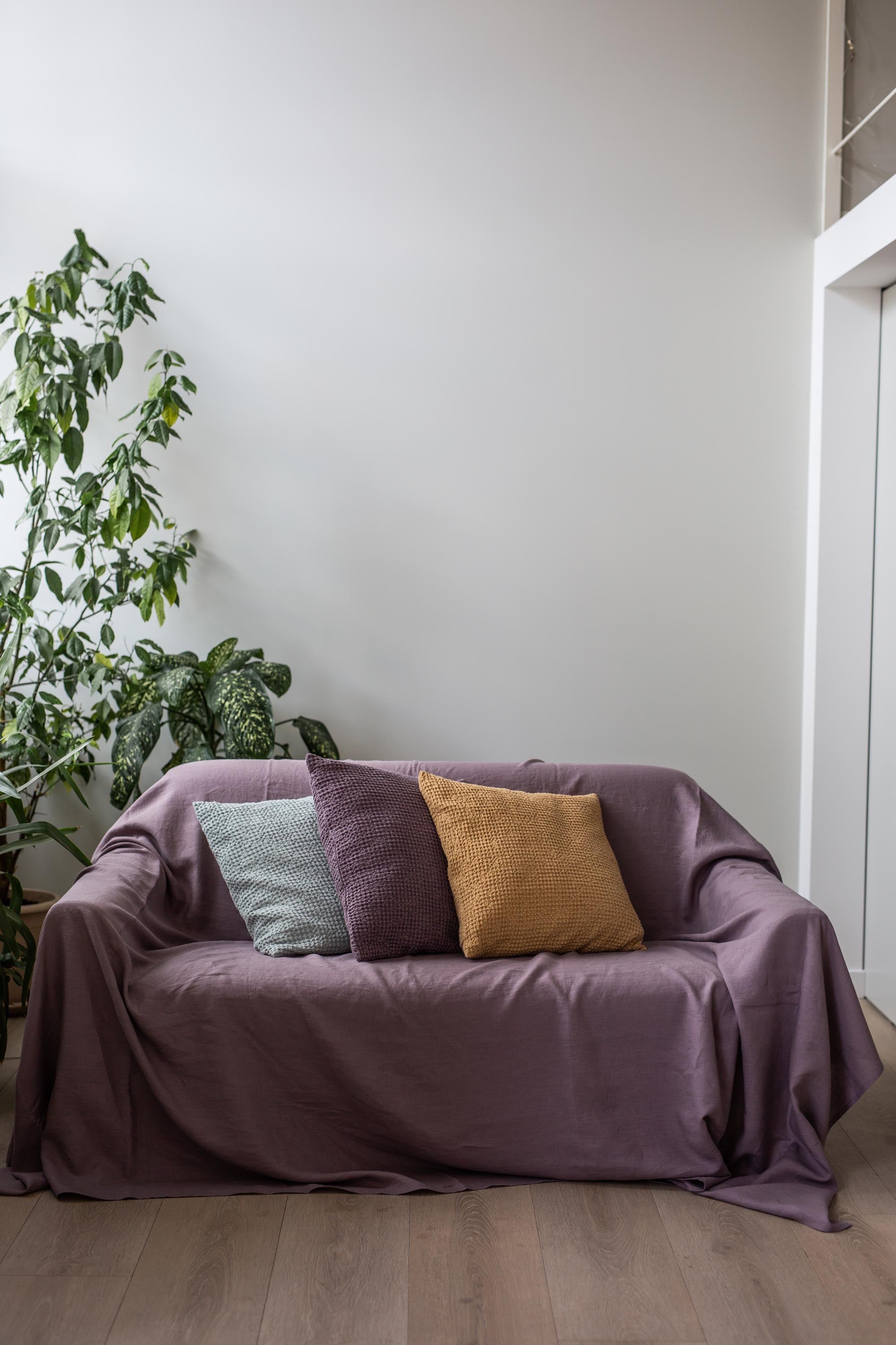 Couch covered with online blanket