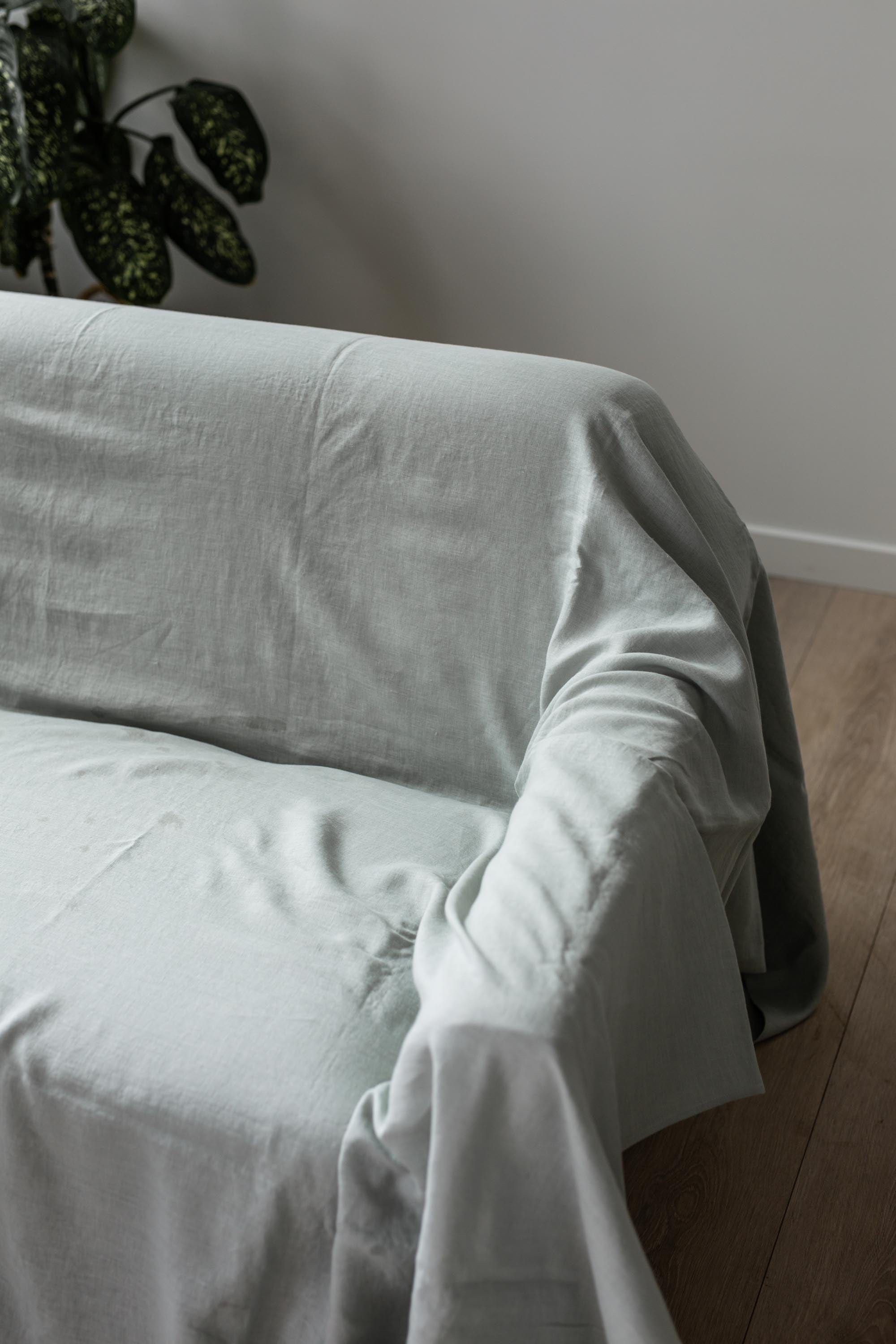 Sage Green Linen Flat Sheet Layed on Couch By AmourLinen