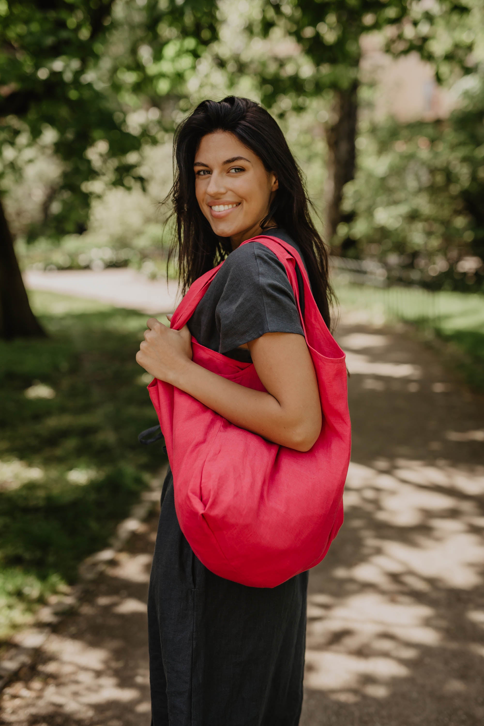 Woman In A Park With A Magenta Red Linen Tote Bag