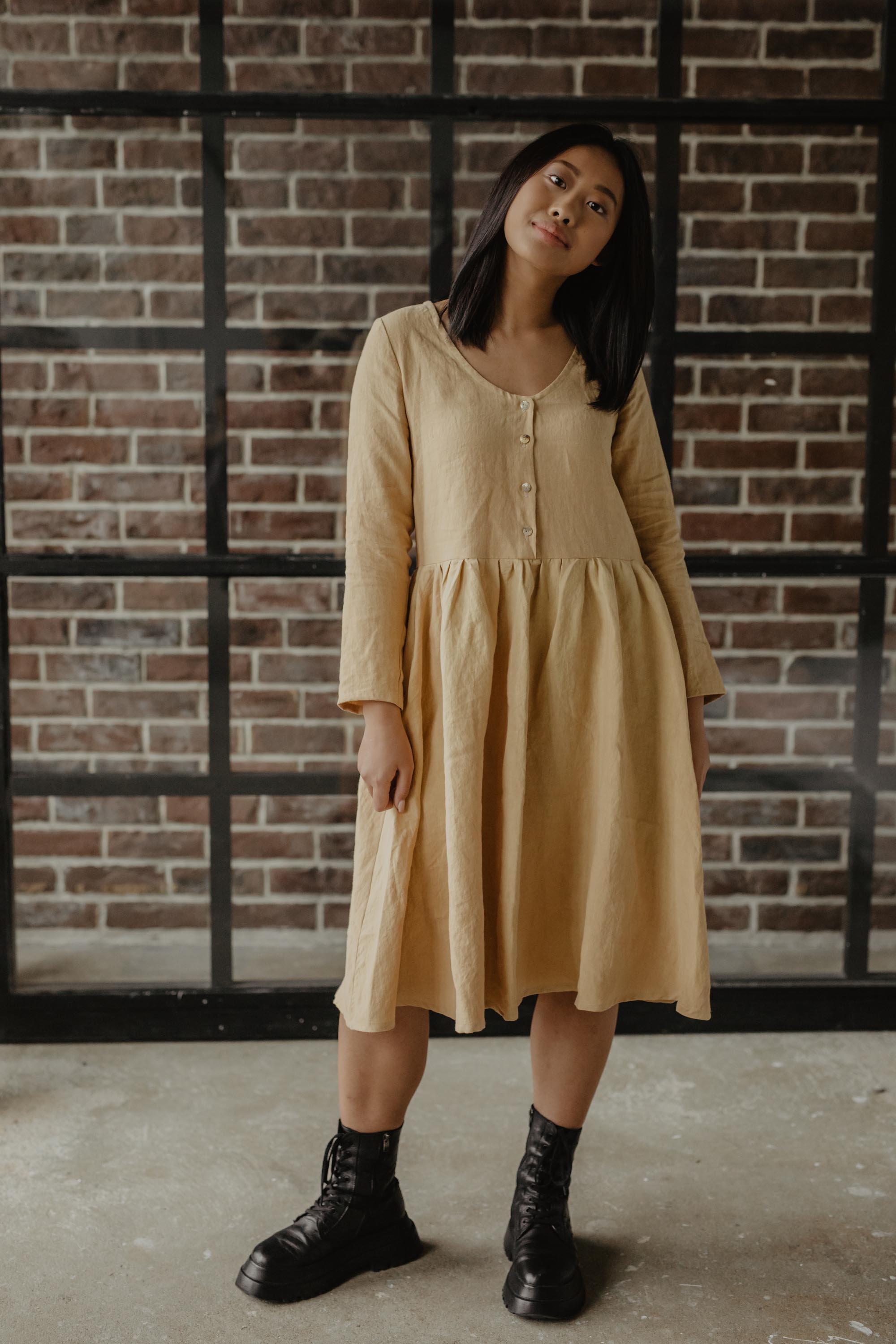 Woman Posing In Mustard Mid-length Linen Dress By AmourLinen