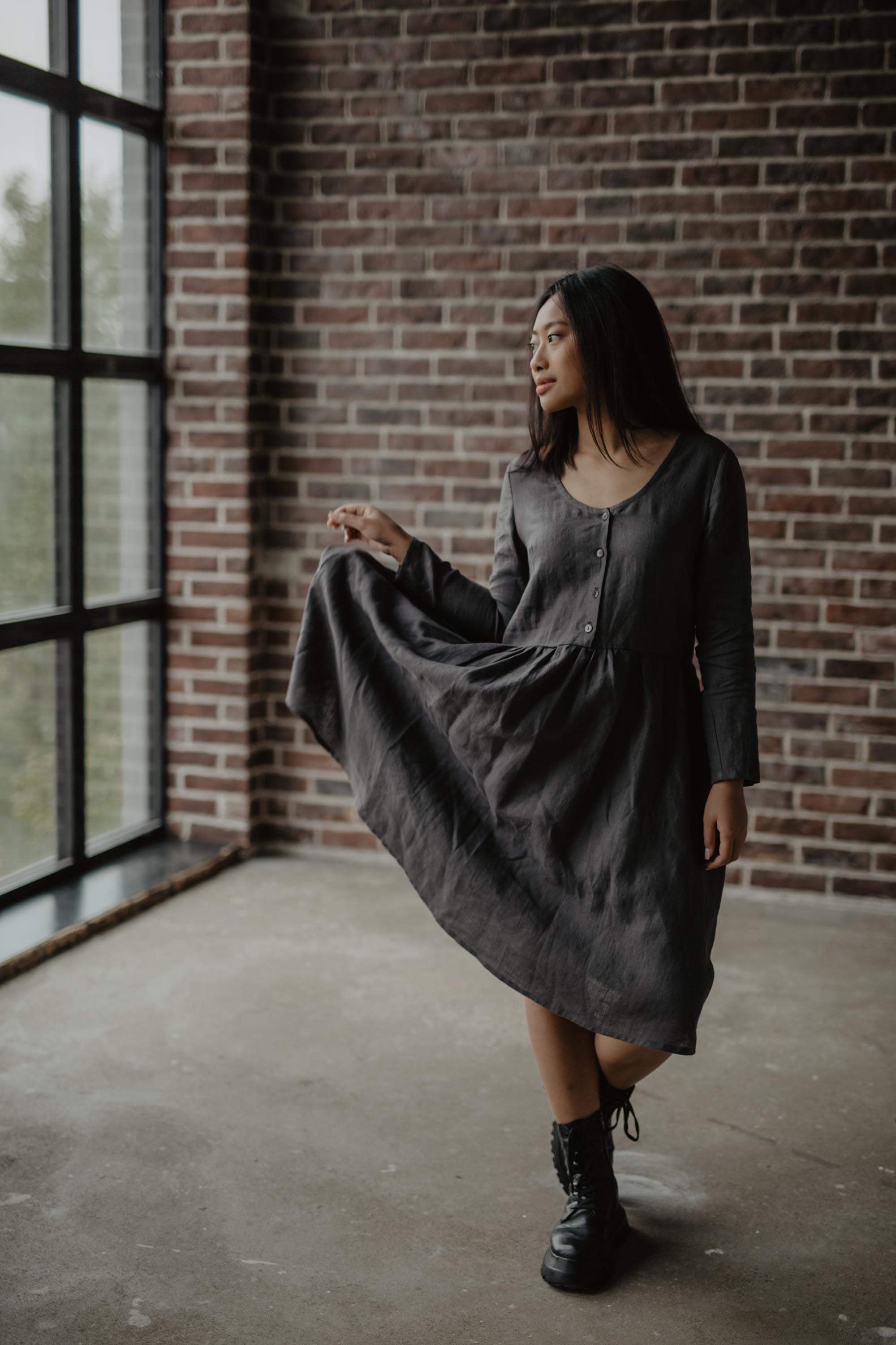 Woman Posing In Dark Mid-Length Linen Dress By AmourLinen