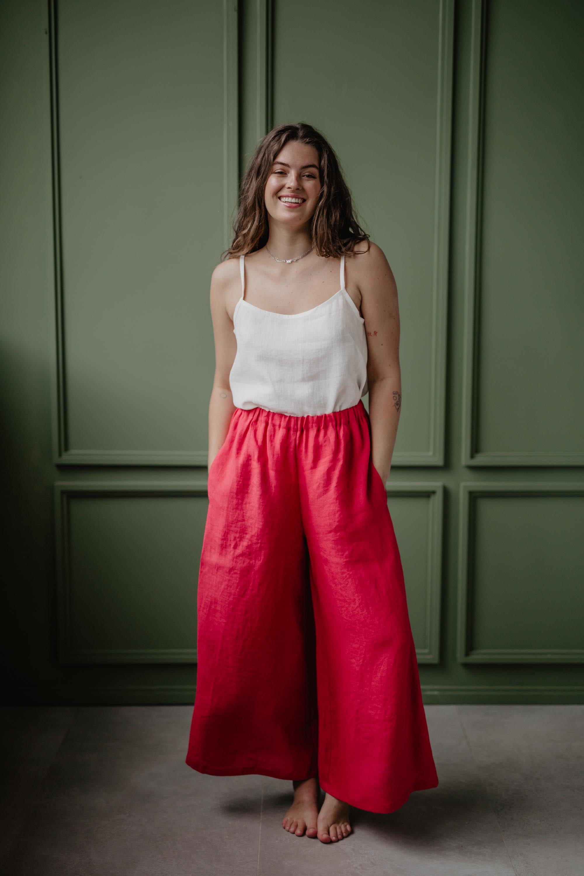Woman Wearing A White Linen Top and Magenta Linen Pants By Amourlinen