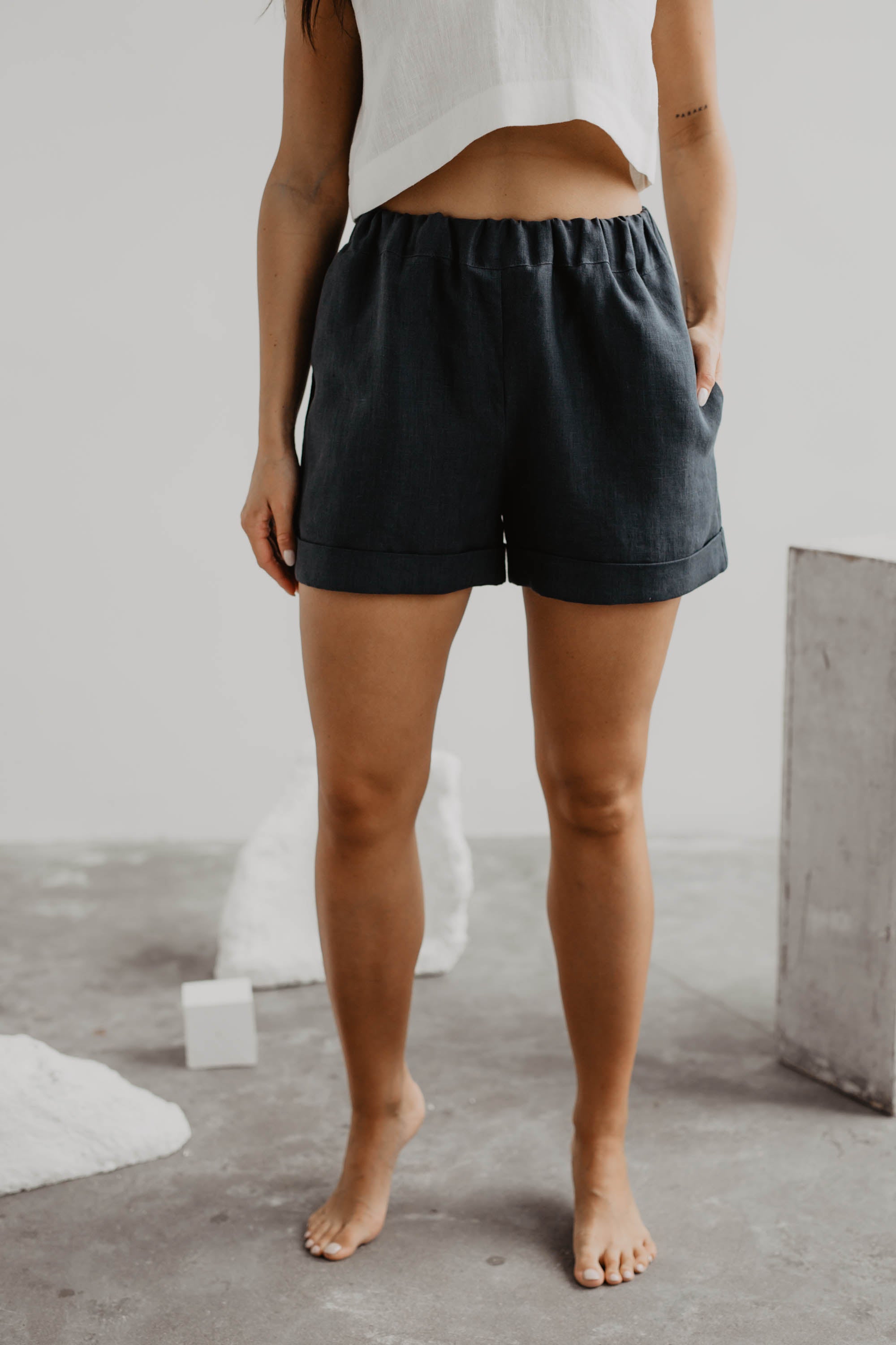 Close Up Of Woman Wearing Charcoal Linen Shorts
