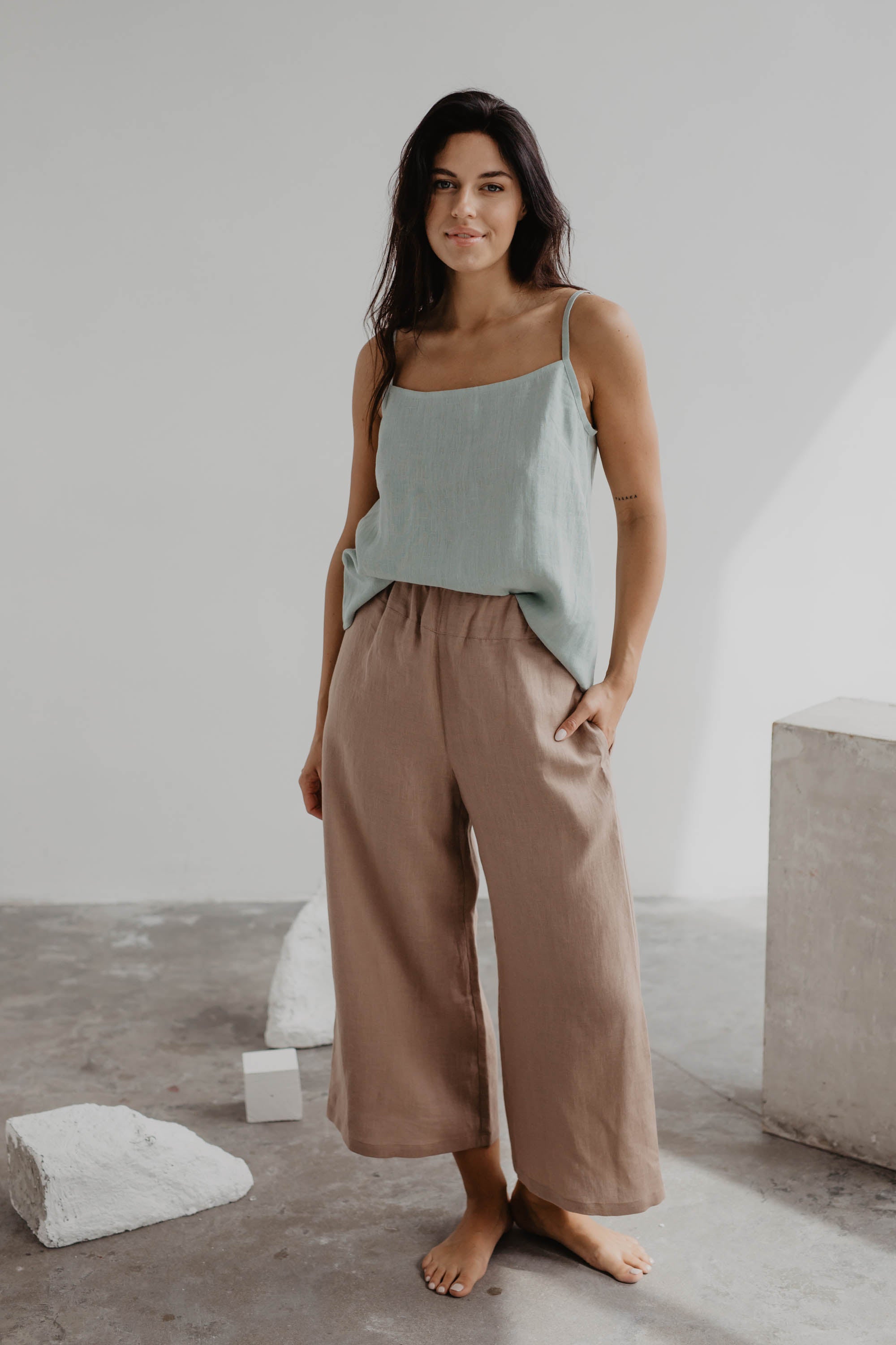 Woman In Gallery Wearing Dusty Rose Linen Pants and Sage Green Linen Top By Amourlinen