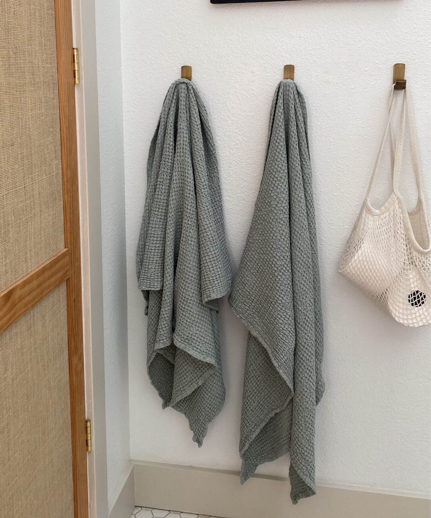 Grey Linen Waffle Towels Hanging In Bathroom