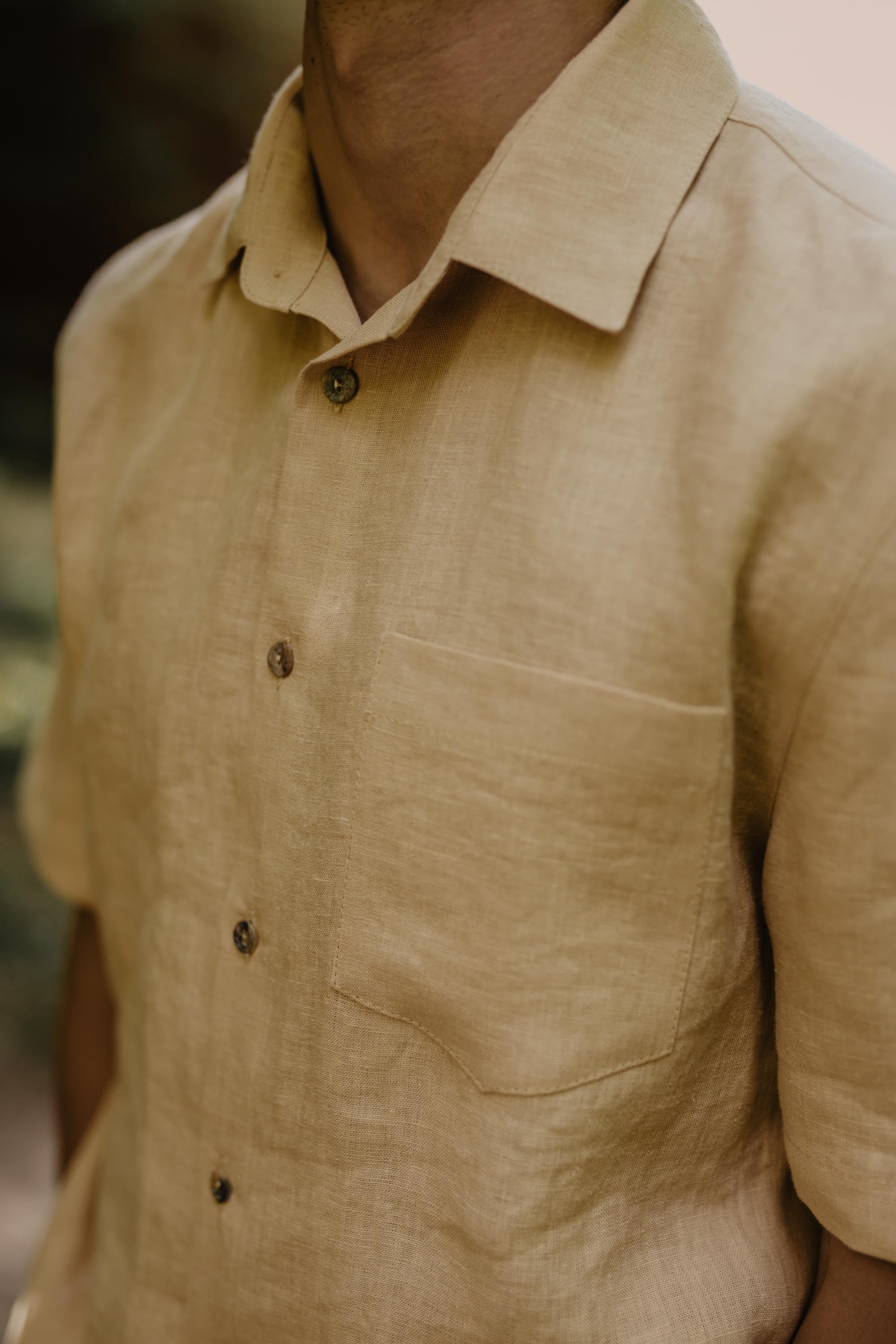 Close Up Of Mustard Color Oversized Linen Shirt Collar And Buttons