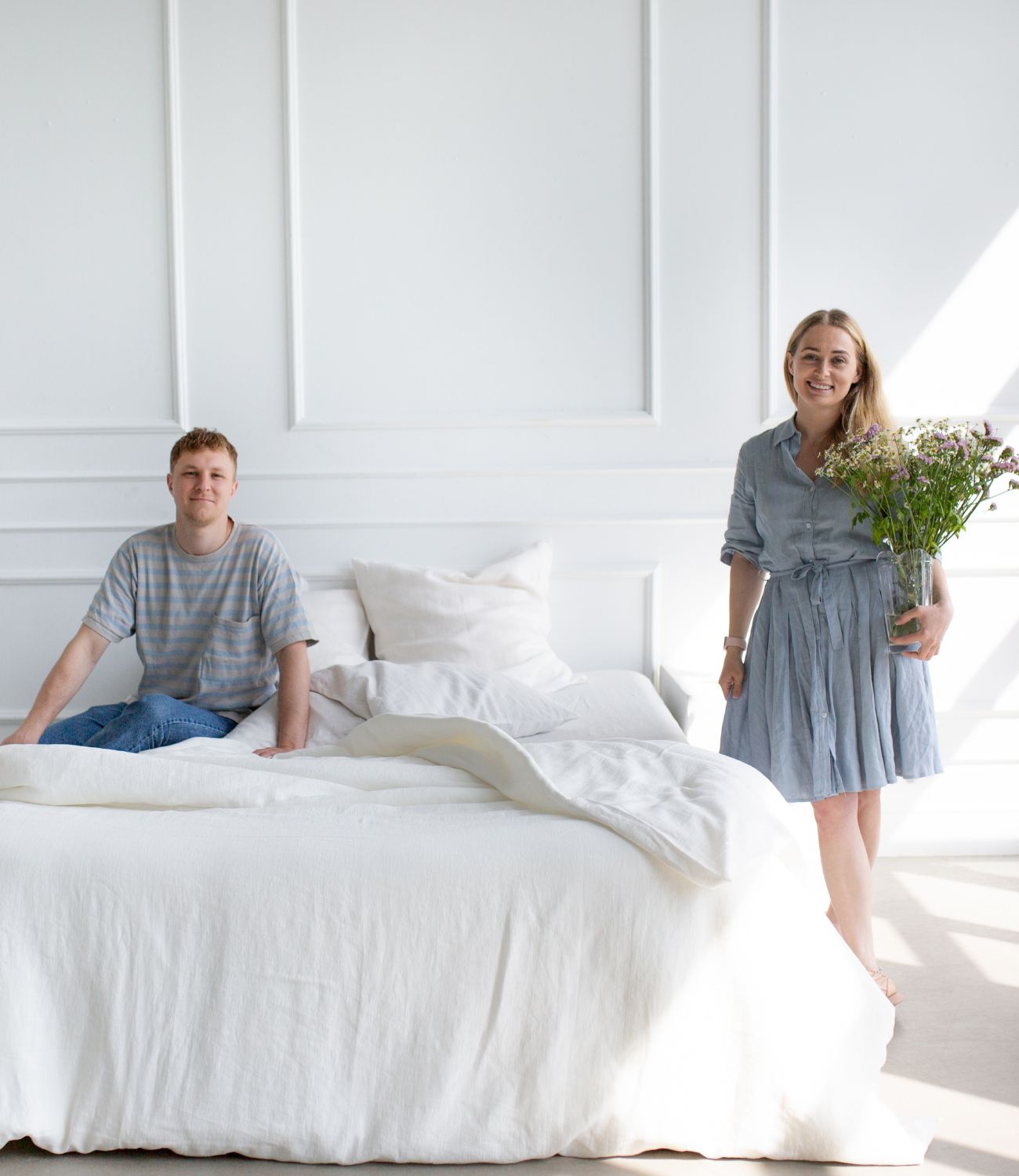 Owner and Co-Owner of Amour Linen Happily Posing In White Room