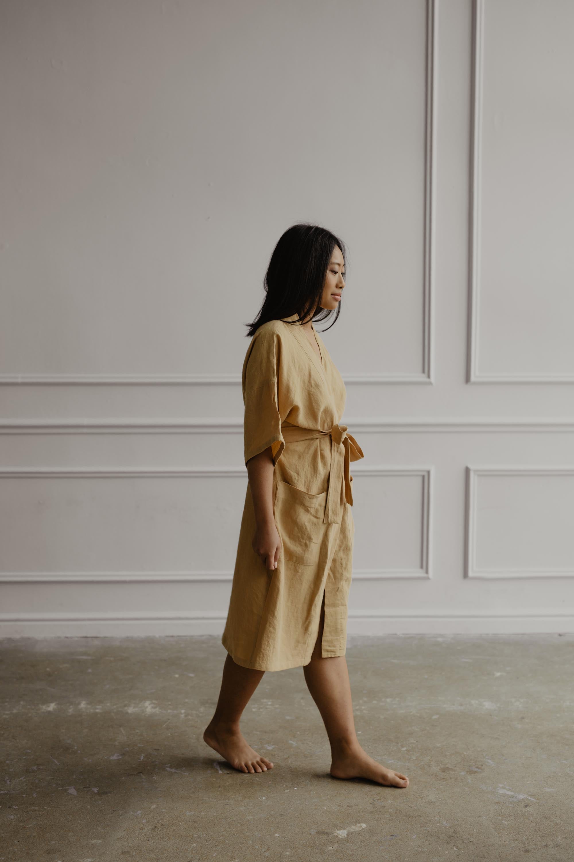 Woman Walking In A Room Wearing A Mustard Linen Bathrobe By Amourlinen