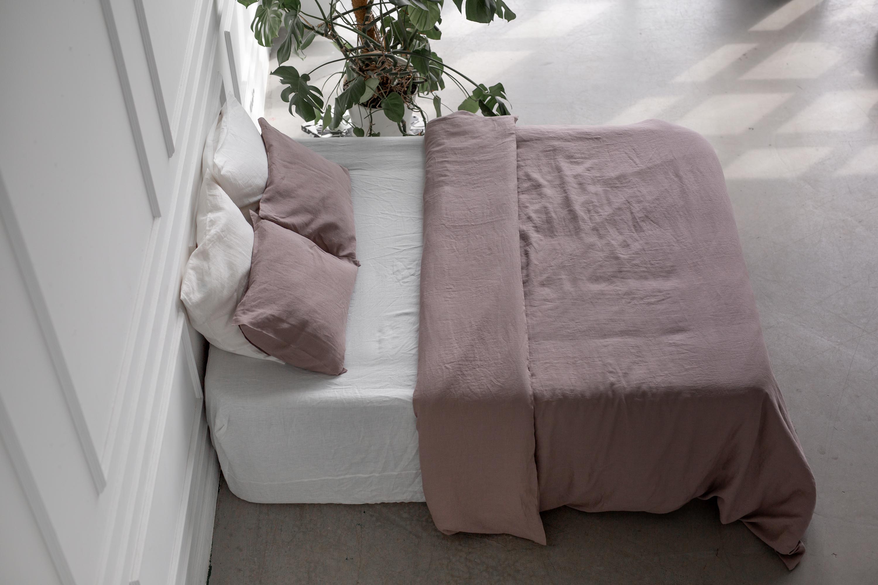 Side View of a Bed With A LInen Bedding Set In Rosy Brown BY AmourLinen
