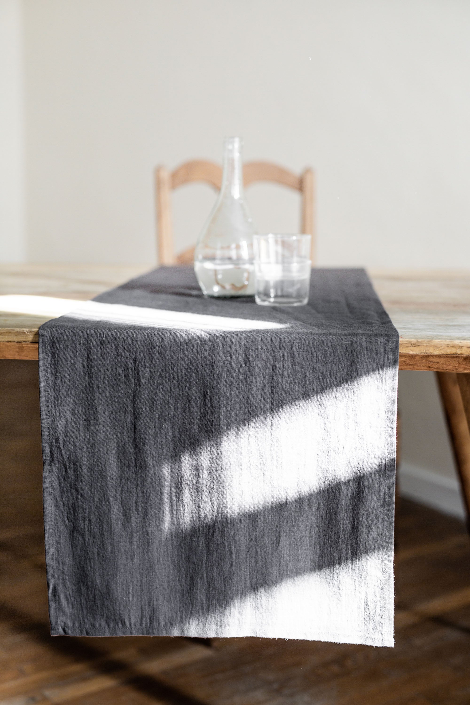 Close up of Dinner Table With Charcoal Linen Table Runner By AmourlInen