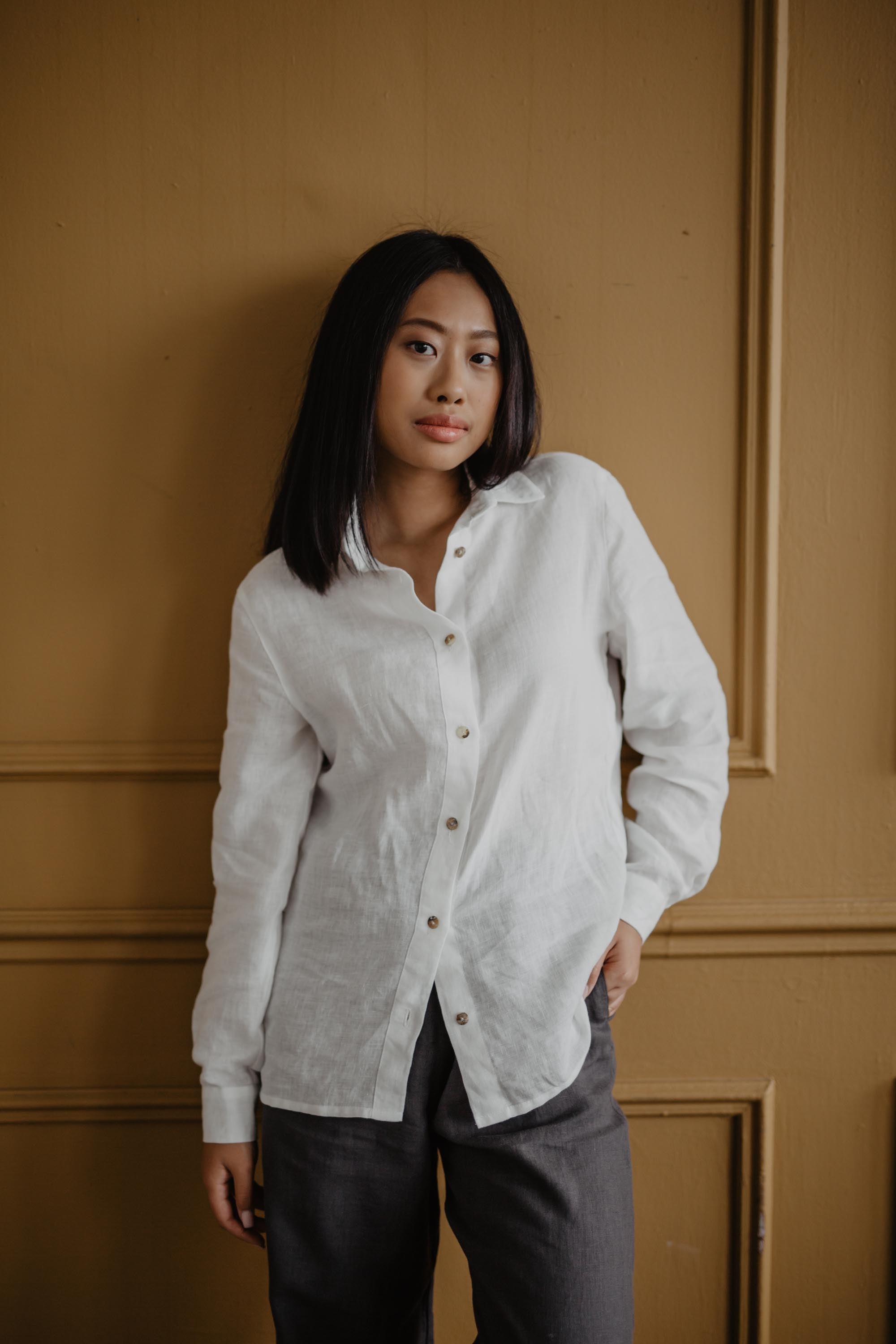 Woman Wearing A White Classic Linen Shirt By AmourLinen