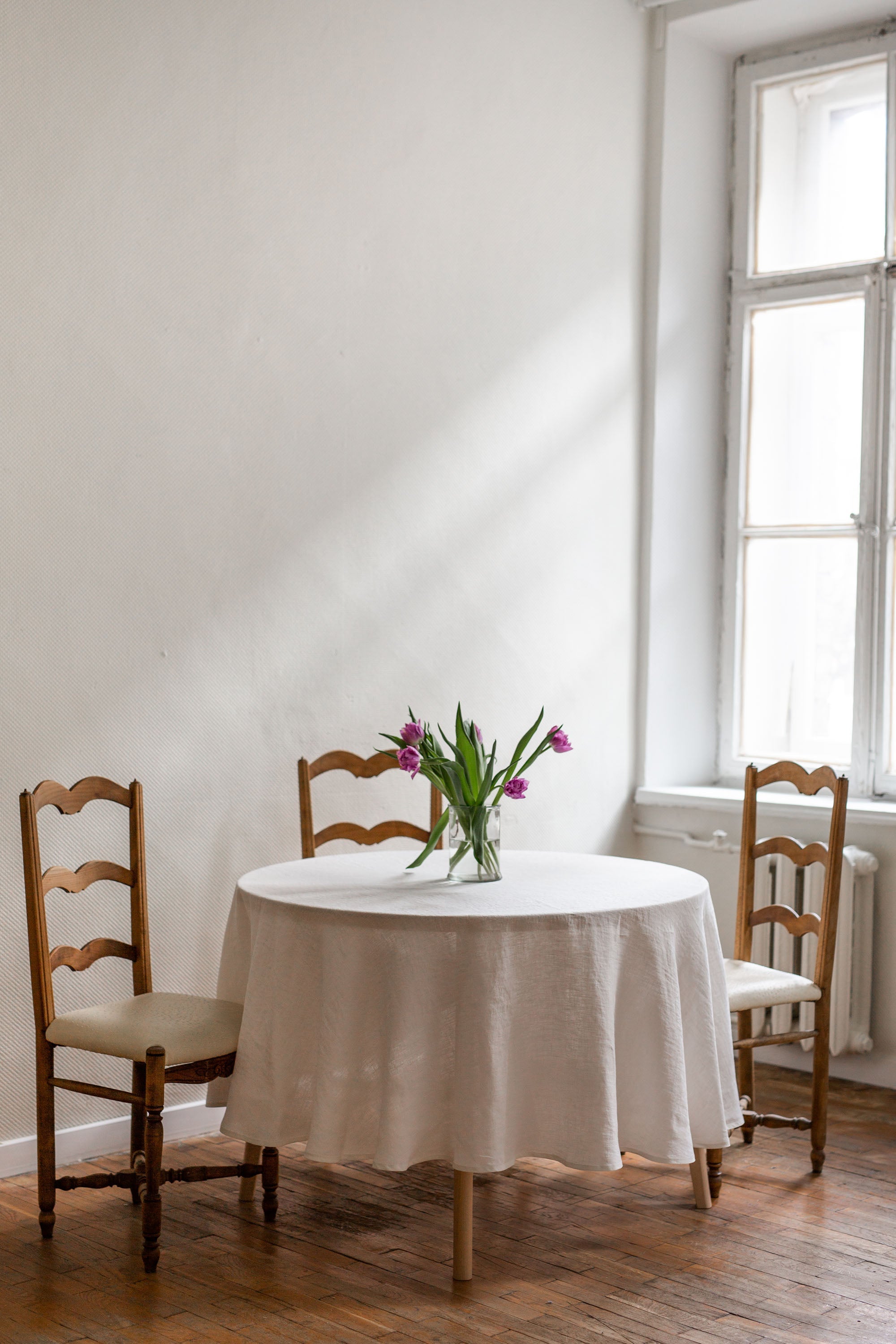 A Rustic Dinner Table With White Linen Tablecloth By AmourlInen