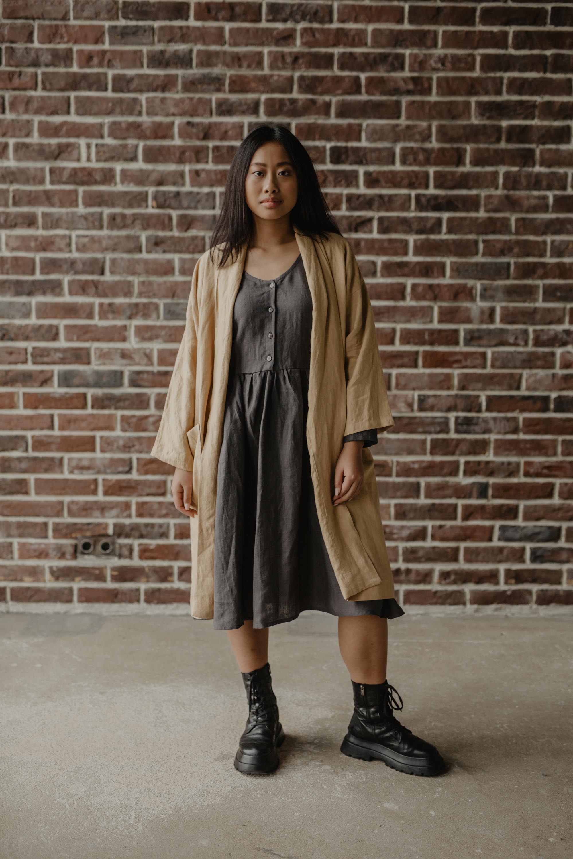 Woman Wearing A Mustard Color Mid-length Linen Coat By AmourLinen