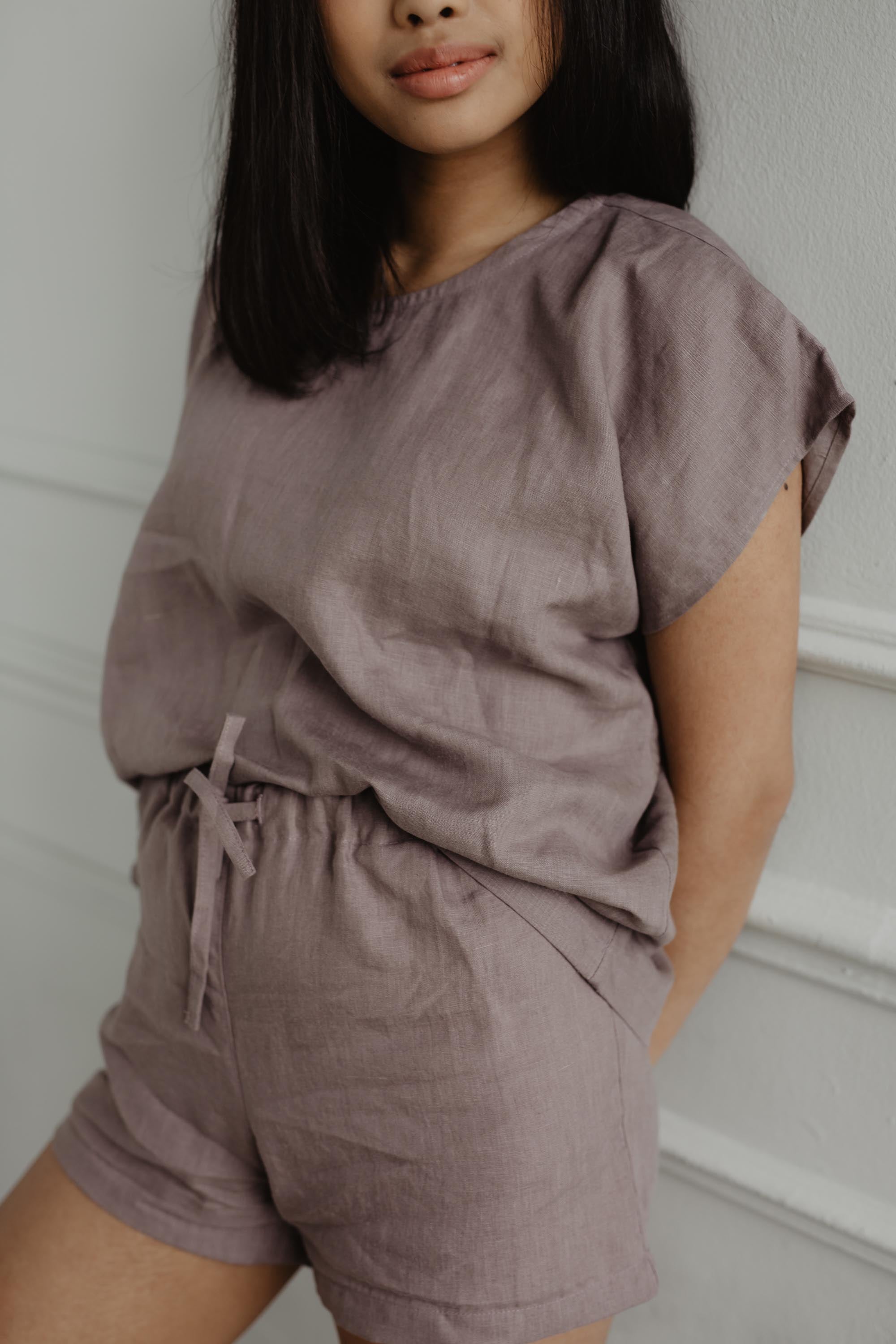 Close Up Of Woman Wearing A Short Sleeve Rosy Brown Linen Pajama Set By AmourLinen