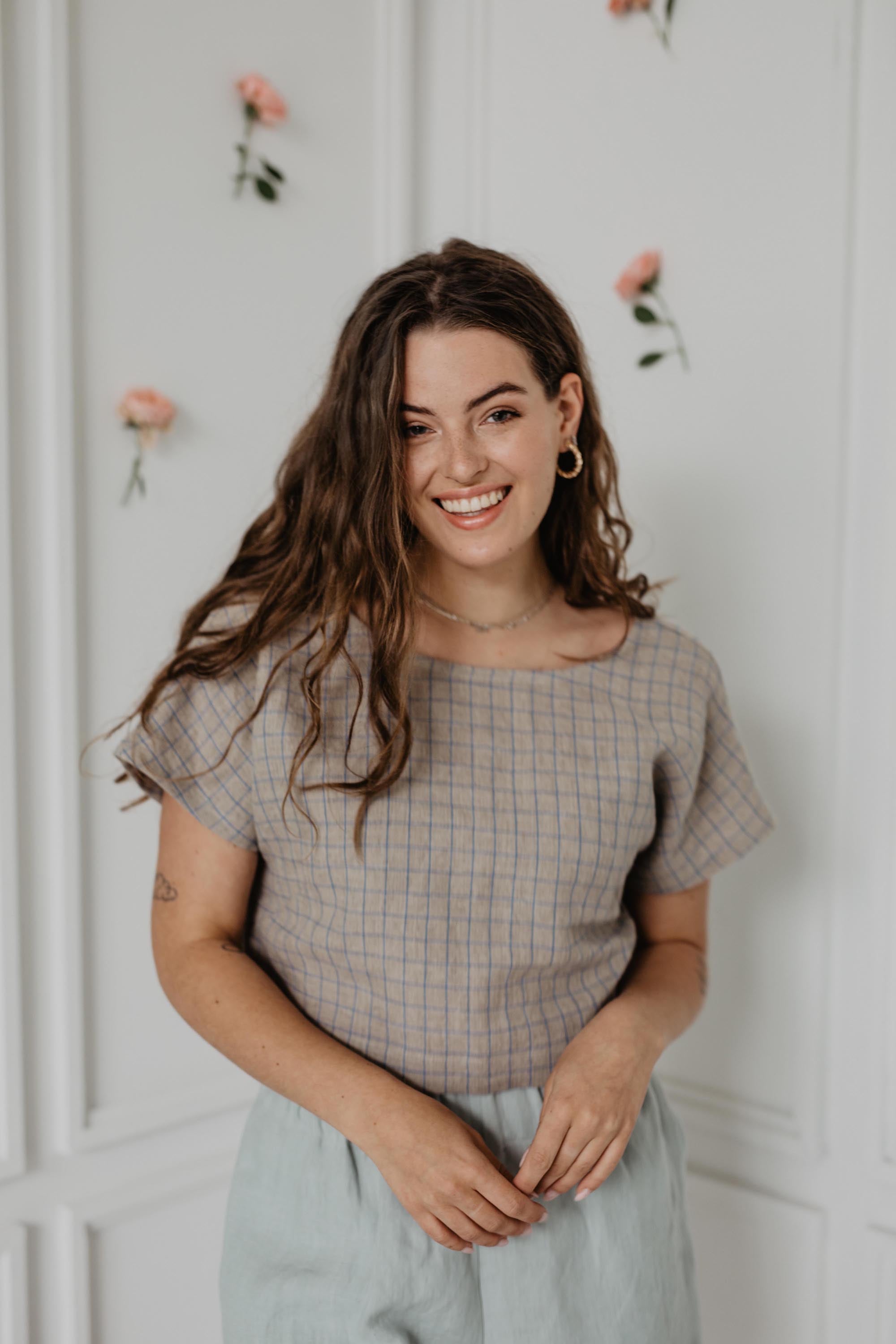 Woman Smiling Wearing A Checkered Linen Crop Top