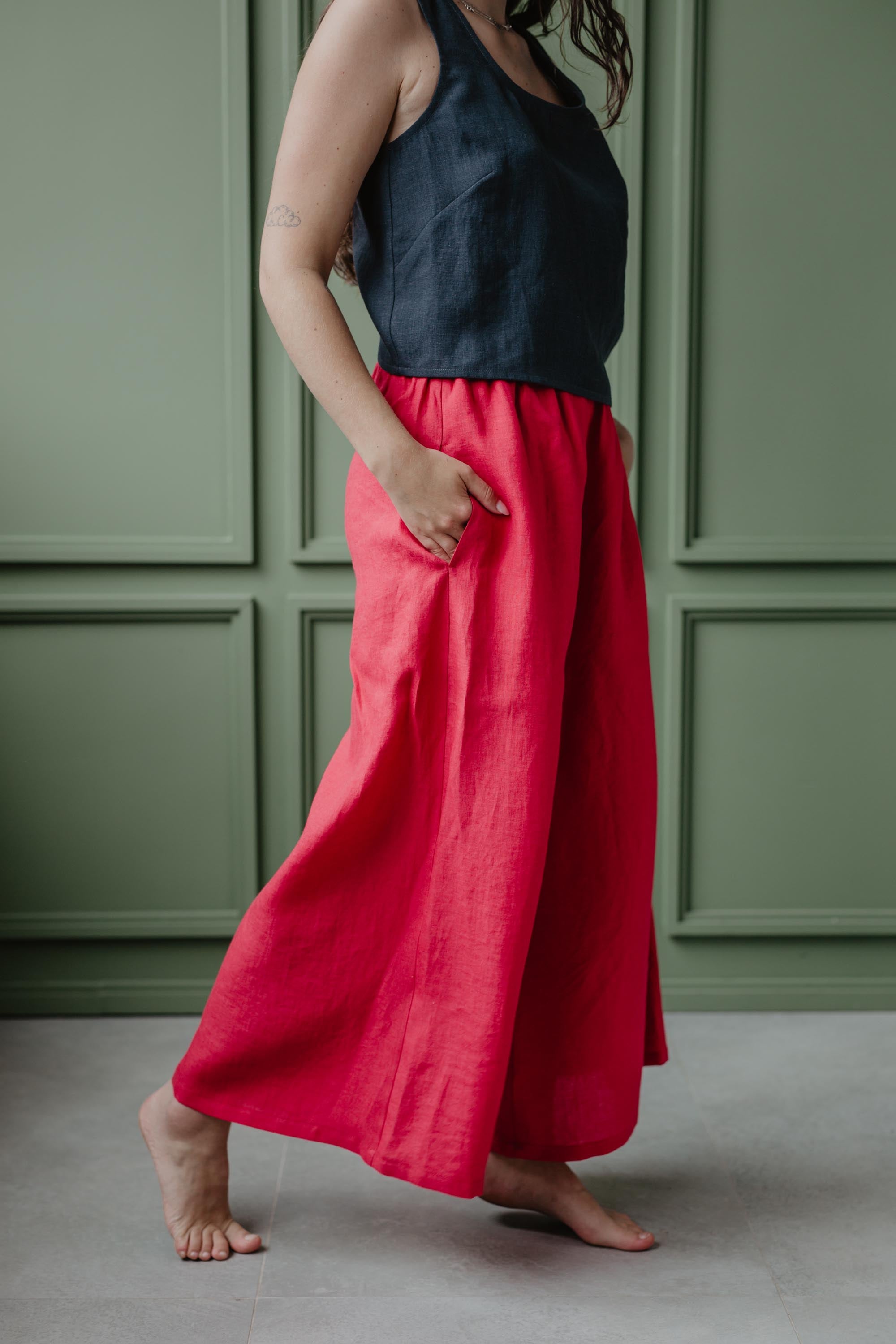 Close Up Of  Woman Wearing Wide Viva Magenta Linen Pants And Charcoal Color Linen Top