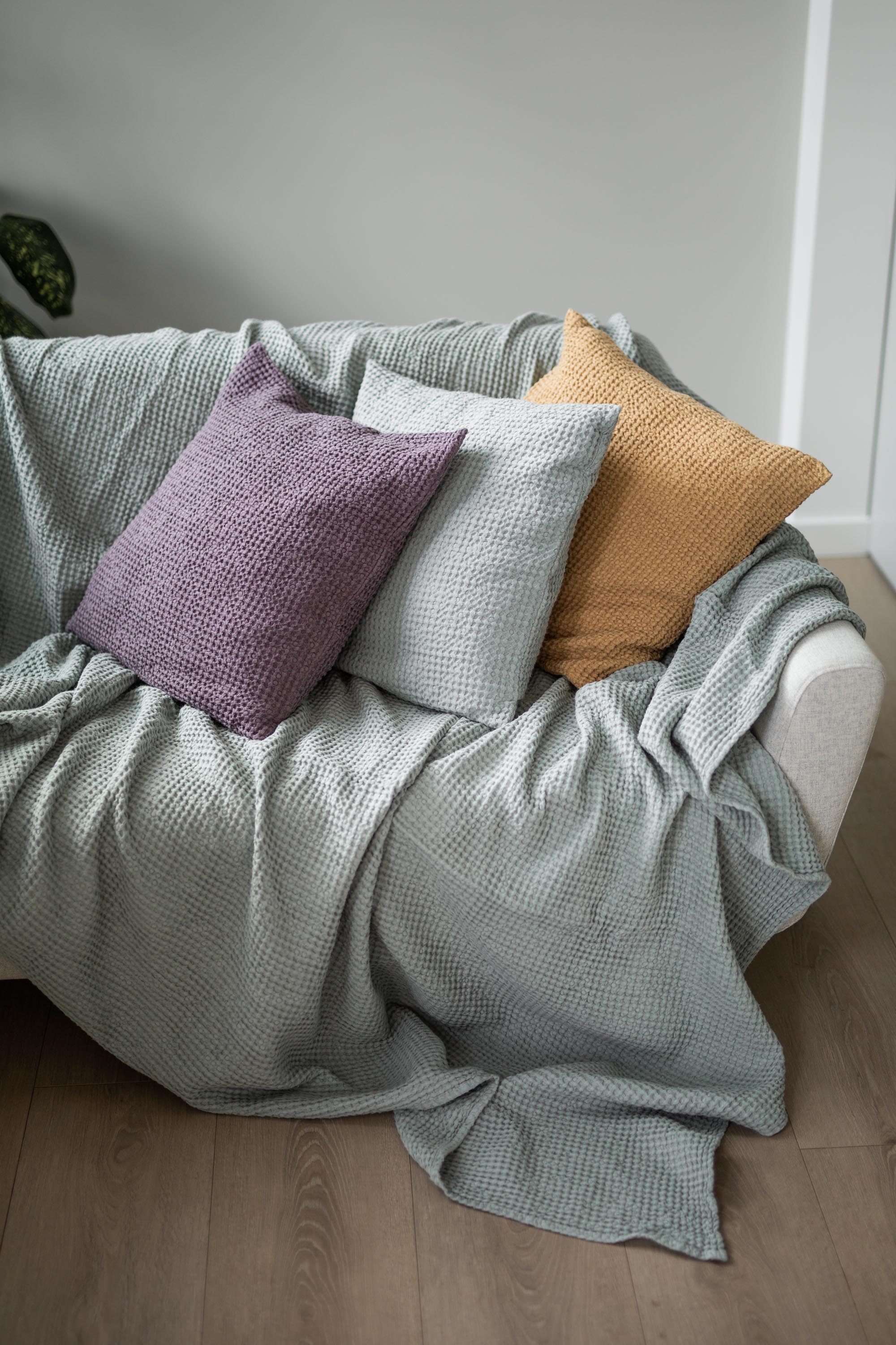 Sage Green Linen Waffle Blanket On Couch With Pillows By AmourLinen