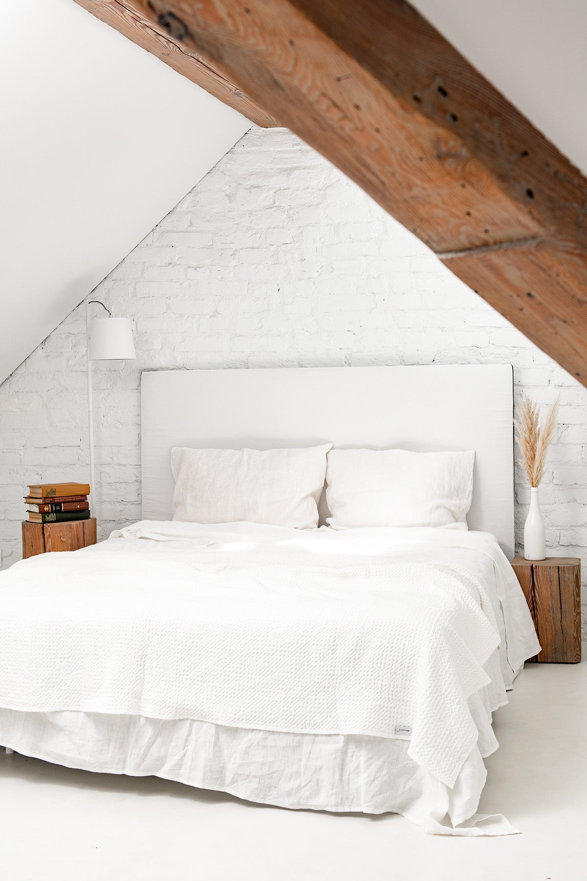 White Linen Waffle Blanket on Bed of A Rustic Room by Amourlinen