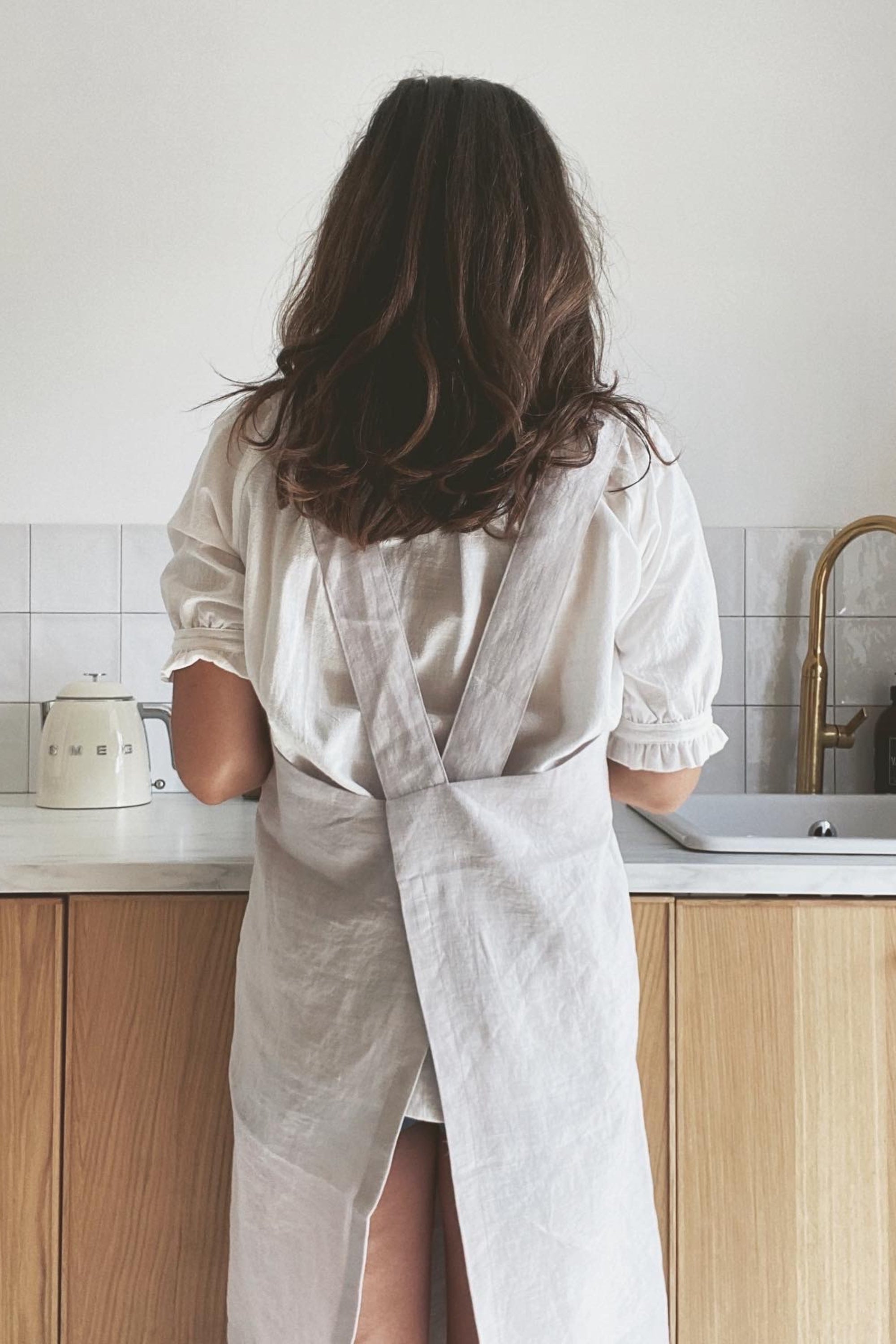 Woman Facing Back Wearing Japnese Linen Apron In Cream By Amourlinen