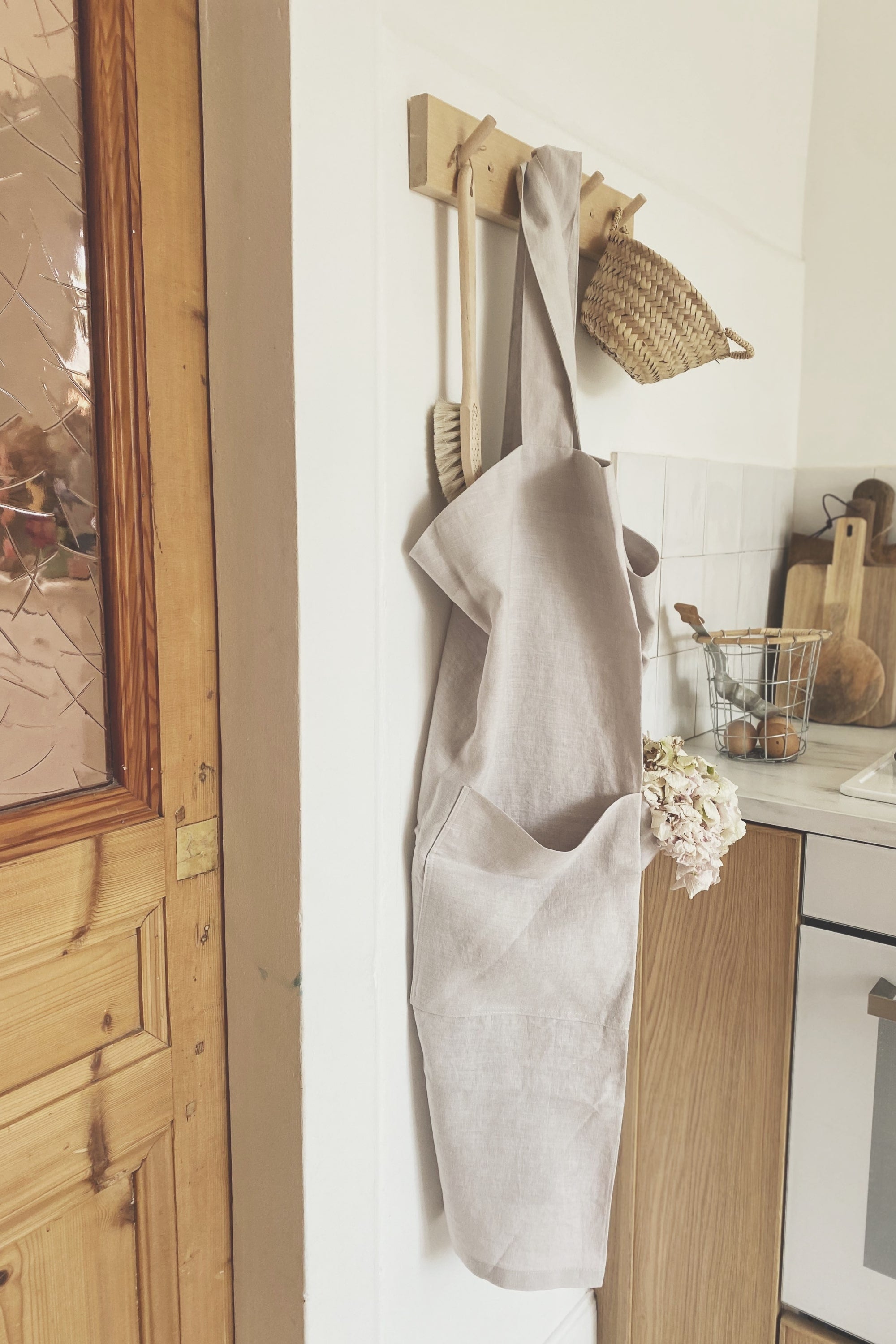 Japnese Linen Apron In Cream Hanging on wall By Amourlinen