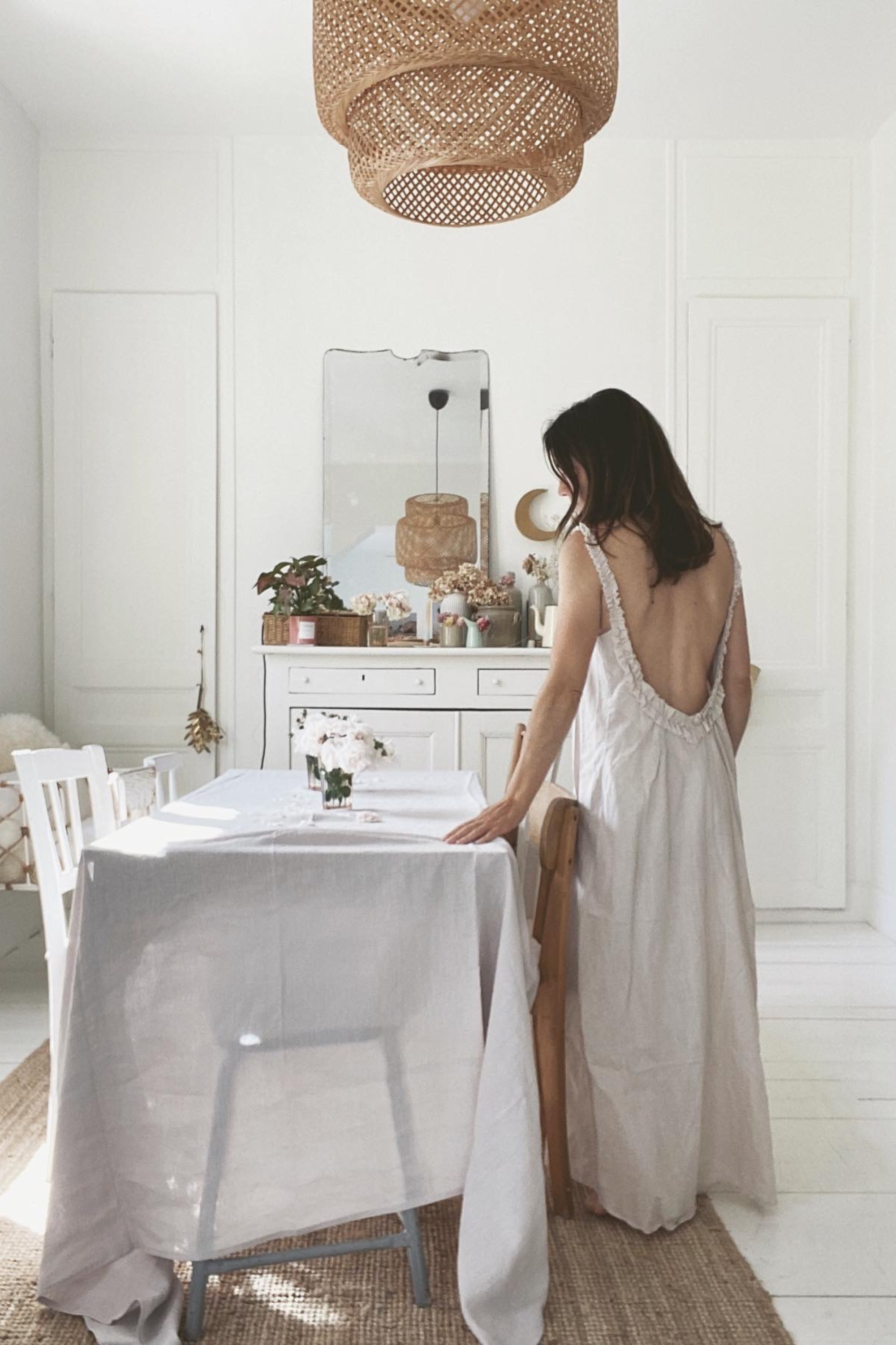 Woman Touching A Cream Linen Tablecloth By Amourlinen