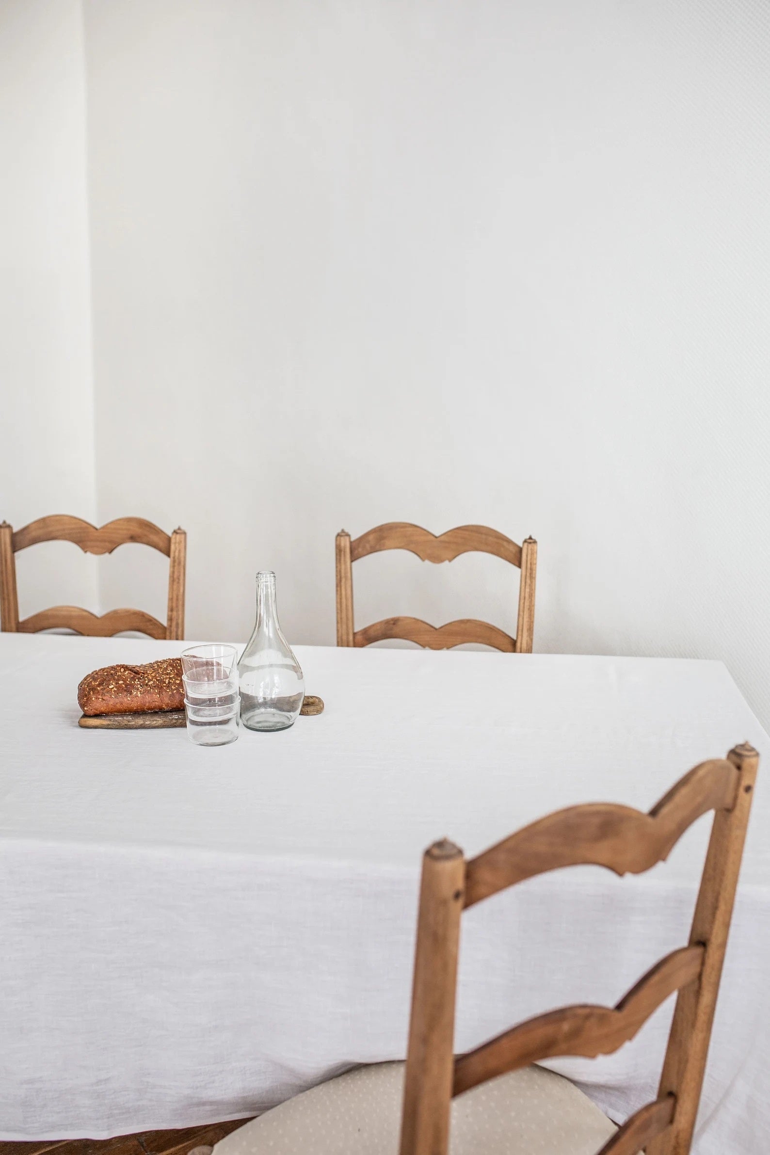 Close Up Of Dinner Table With White Linen Tablecloth By AmourLinen