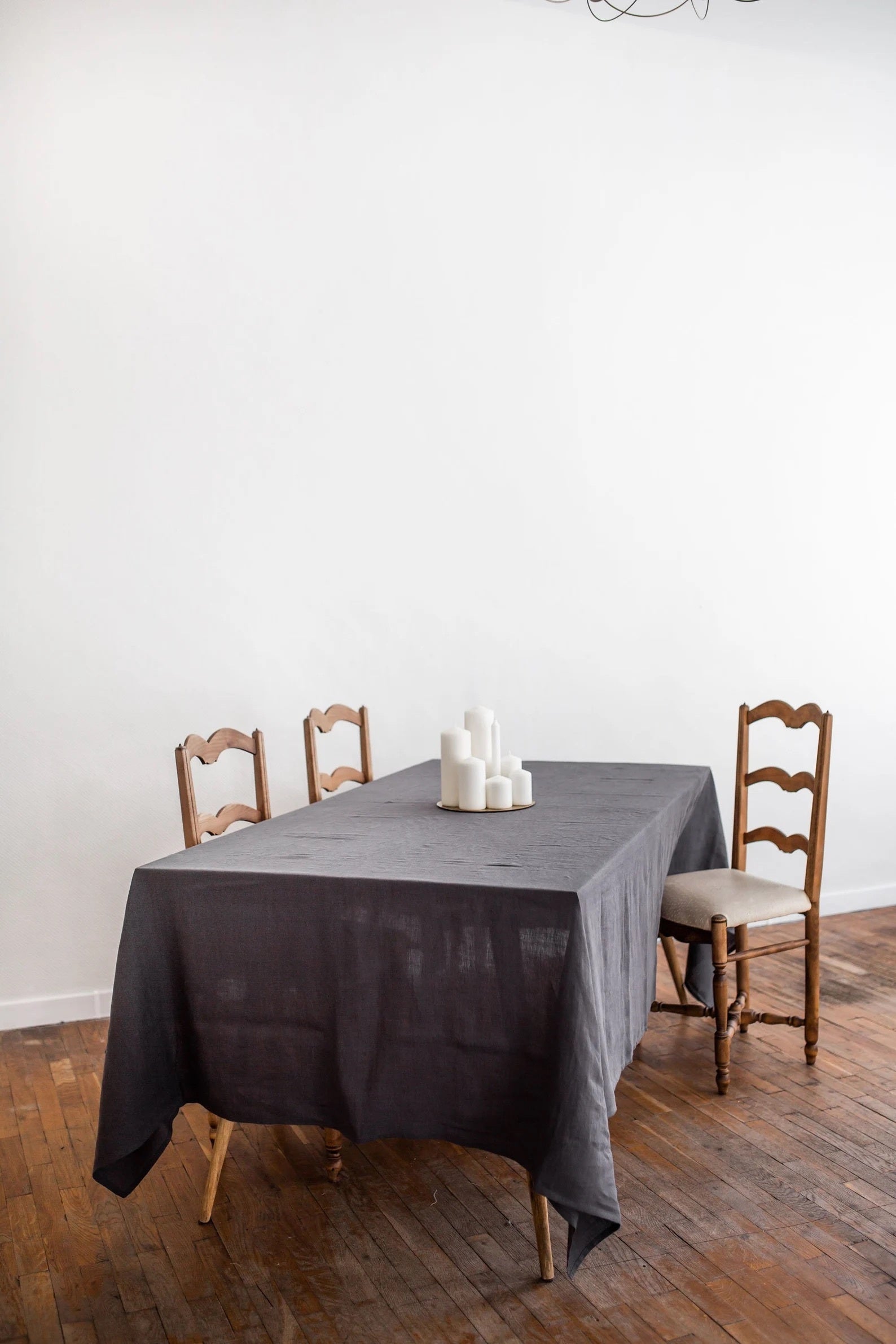 Dinner Table With Candles Placesd on Charcoal Linen Tablecloth By Amourlinen
